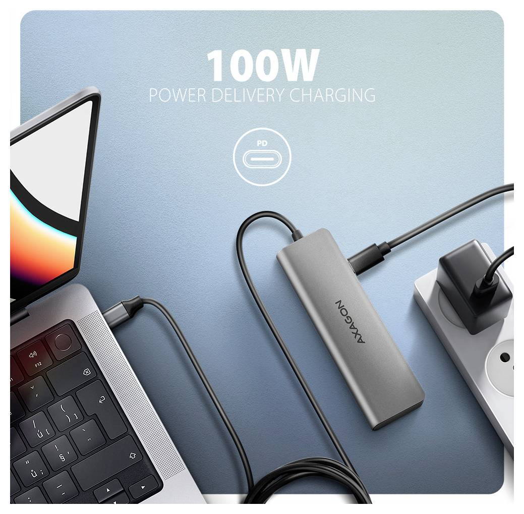 Werbebild eines Laptops, der mit einem USB-C-Hub verbunden ist, mit Text „100W Power Delivery Charging