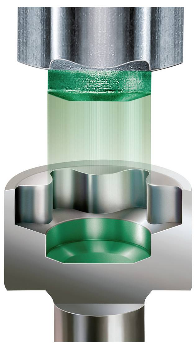 Querschnitt einer Presse, die ein Metallteil formt, wobei grünes Material in eine Stanzform gepresst wird.