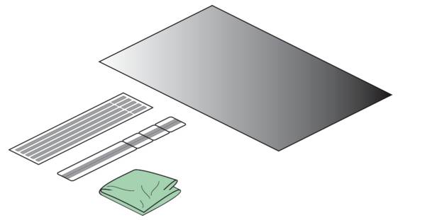 Illustration eines gefalteten grünen Tuchs, eines schlanken Pinsels oder Werkzeugs und eines gestreiften Polsters, die unter einer großen grauen rechteckigen Fläche angeordnet sind.
