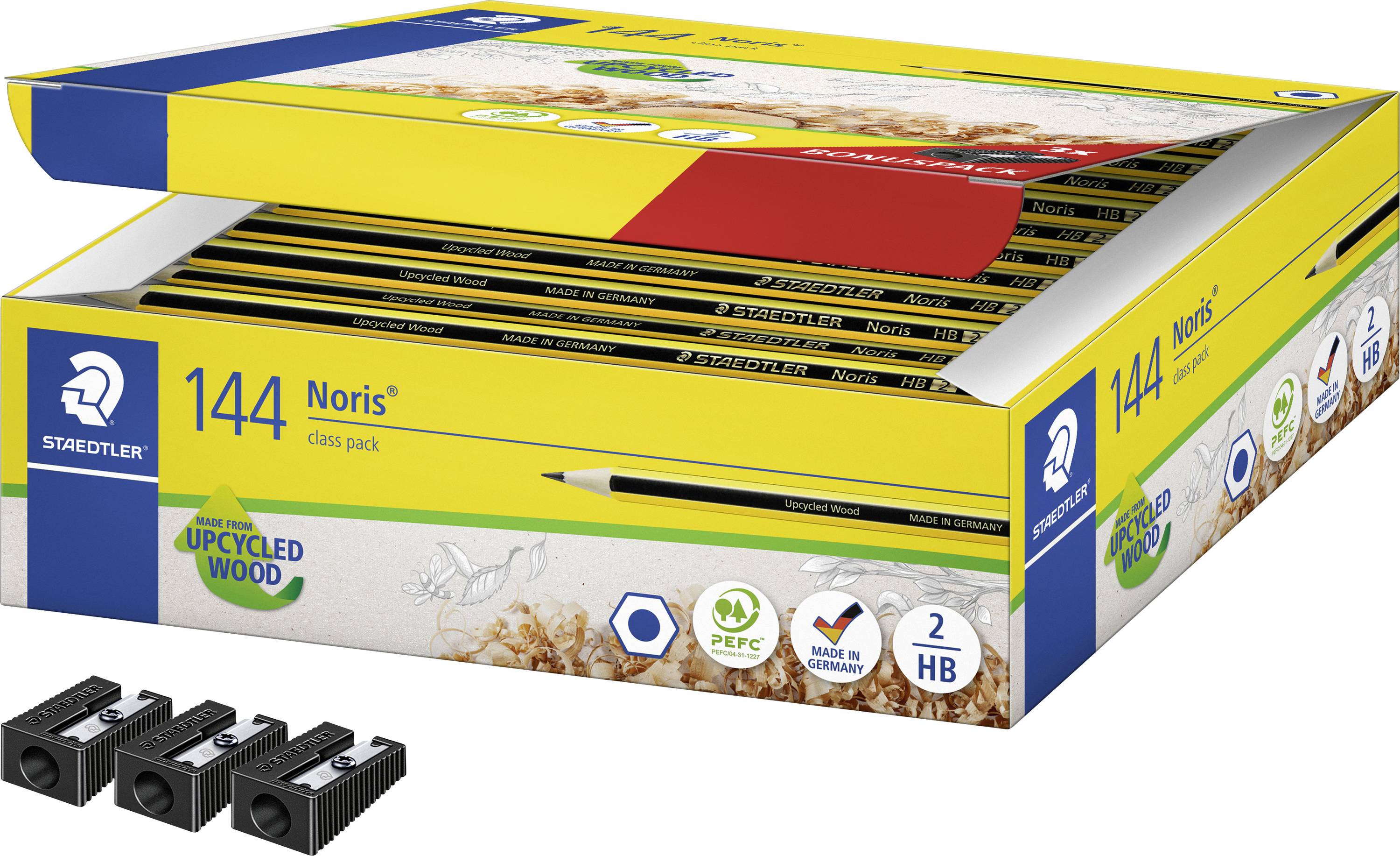 Offene Schachtel mit Staedtler Noris Farbstiften, 144er Klassenpackung in einer gelben Displaybox, mit drei schwarzen Bleistiftspitzern darunter abgebildet.