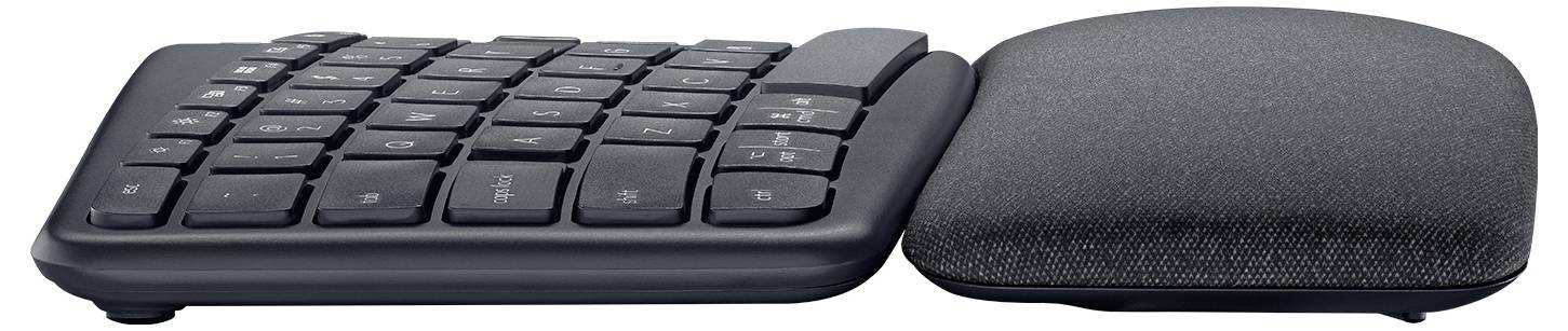 Geteilte ergonomische Tastatur mit separater gepolsterter Handgelenkstütze, in Seitenansicht vor weißem Hintergrund dargestellt.