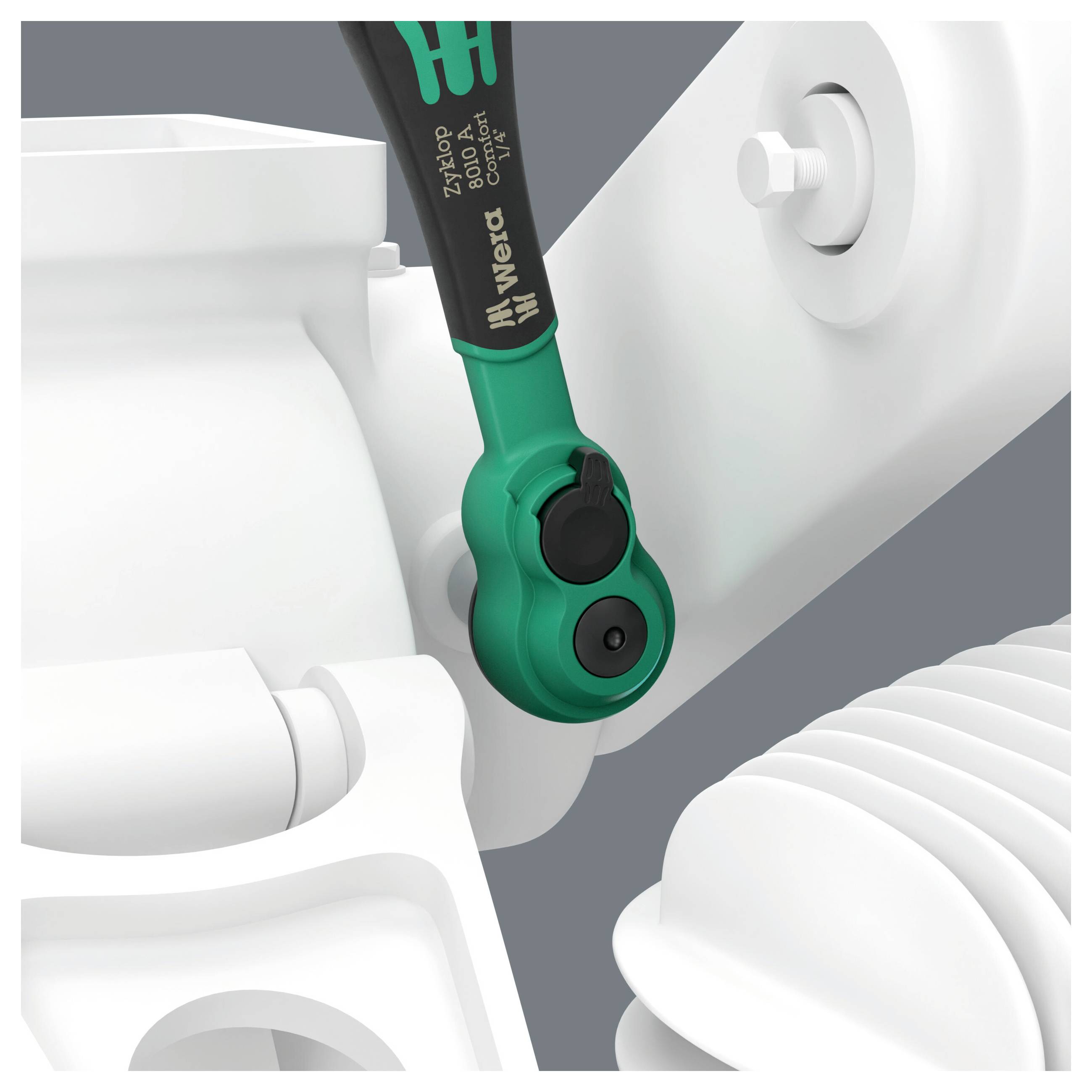 Nahaufnahme eines grün-schwarzen Wera-Schraubendreherbits, das in einem weißen mechanischen Gehäuse oder einer weißen Vorrichtung eingerastet ist.