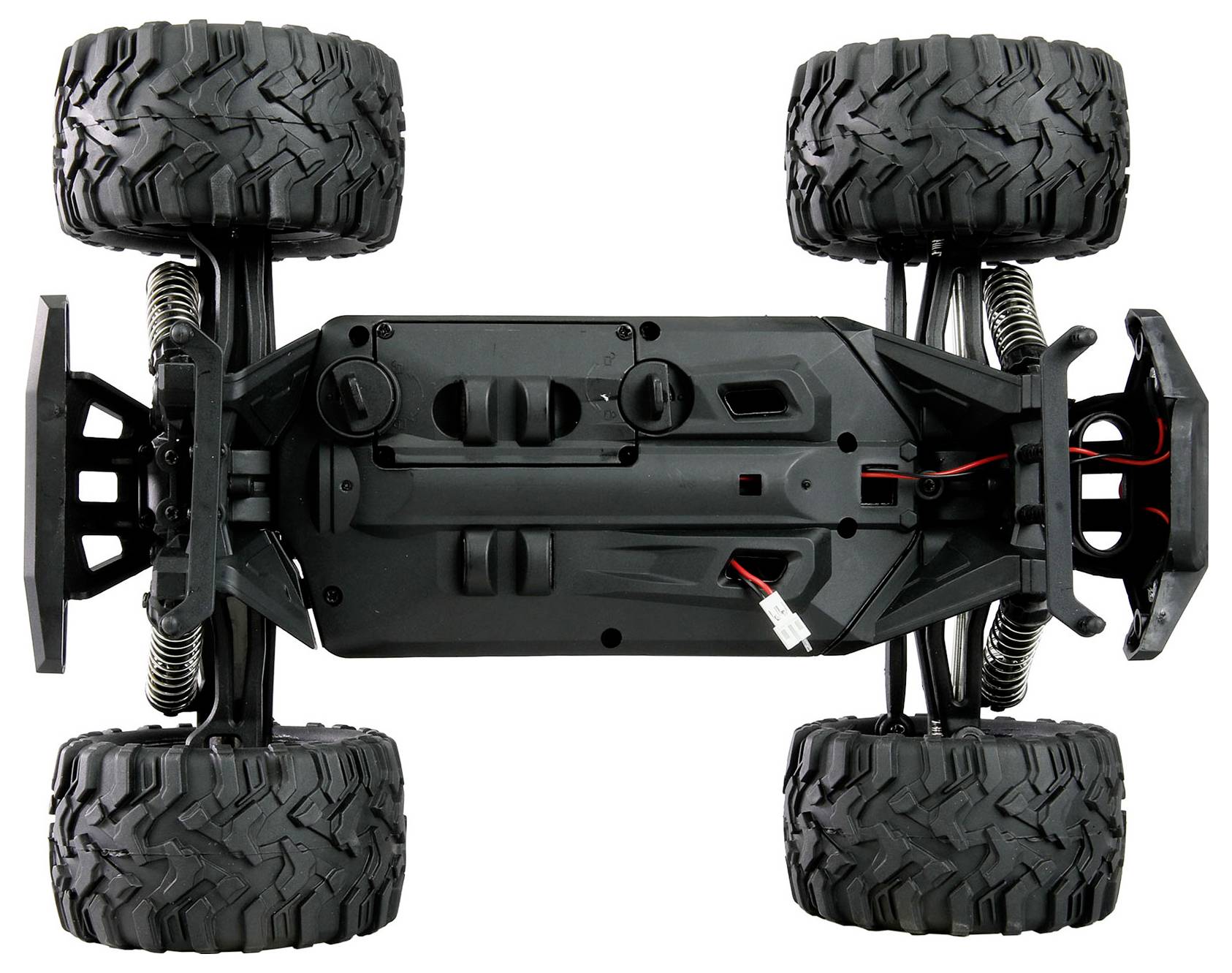 Unteransicht eines vierspurigen RC-Geländewagen-Chassis mit Federung, großen Stollenreifen und freiliegender Verkabelung.