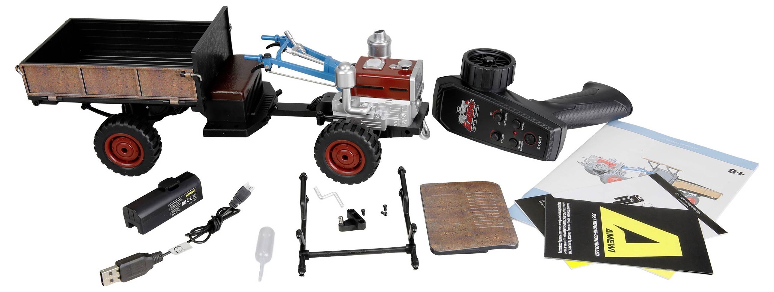 Spielzeug-Ferngesteuerten Traktor mit Anhänger, gezeigt mit Fernbedienung, Ladegerät, Batterie und Bedienungsanleitungen auf weißem Hintergrund ausgelegt.