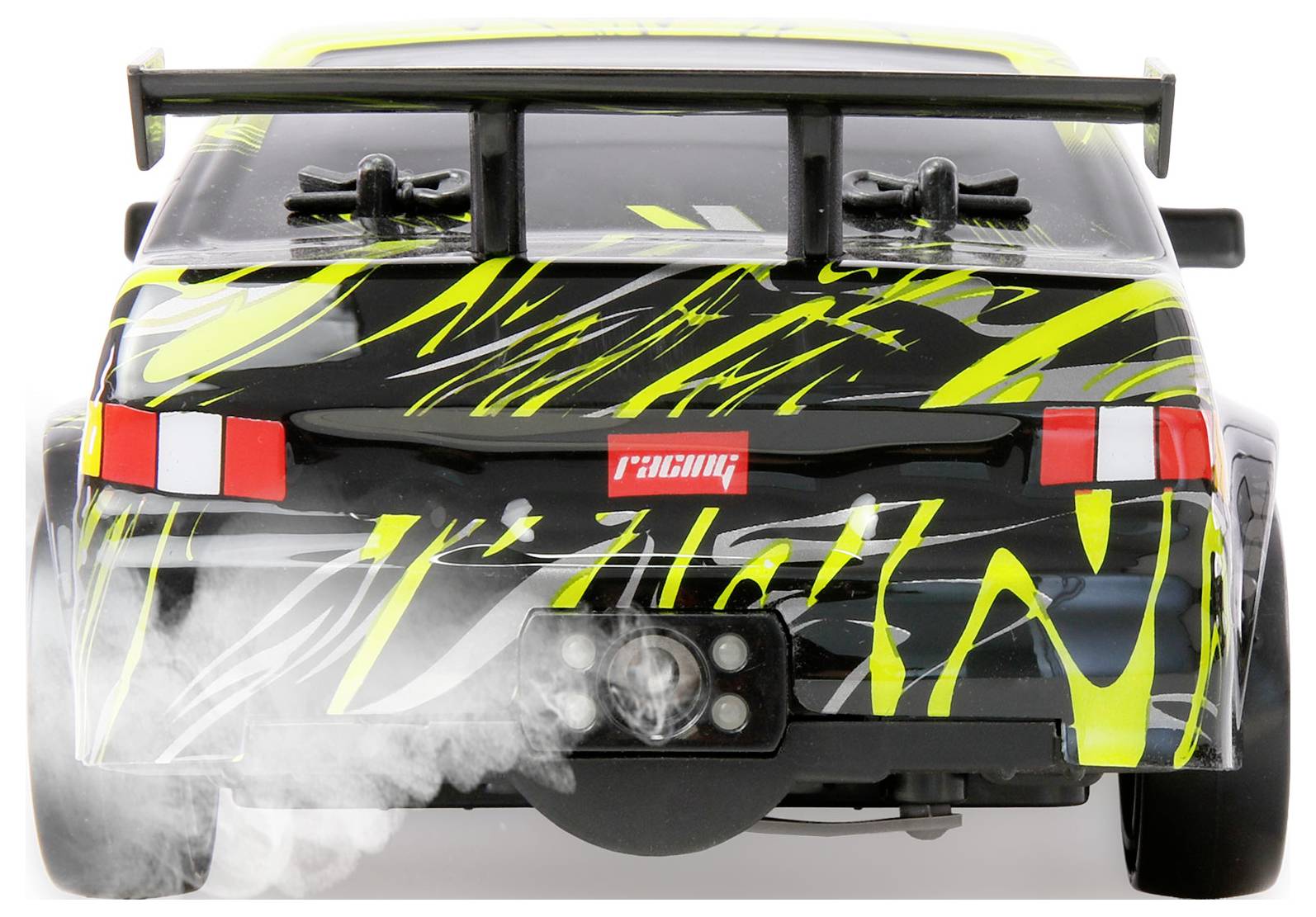 Vorderansicht eines schwarzen und neongelben RC-Rennwagens beim Driften, mit Rauch von den vorderen Rädern und einem großen Heckspoiler.