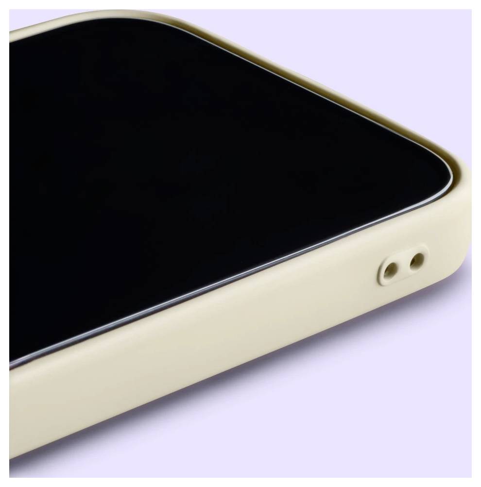 Nahaufnahme einer beigen Smartphone-Ecke mit schwarzem Bildschirm und zwei seitlichen Öffnungen auf hellviolettem Hintergrund.