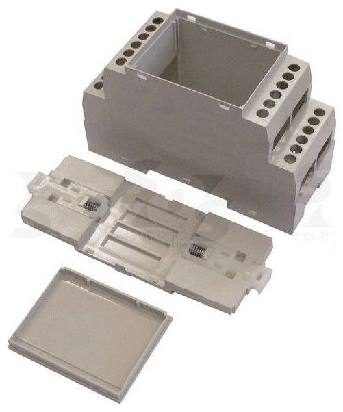 Explosionsdarstellung eines grauen Elektroschranks: äußeres Gehäuse mit Schrauchlöchern, interne Basiskomponente und separater flacher Deckel.