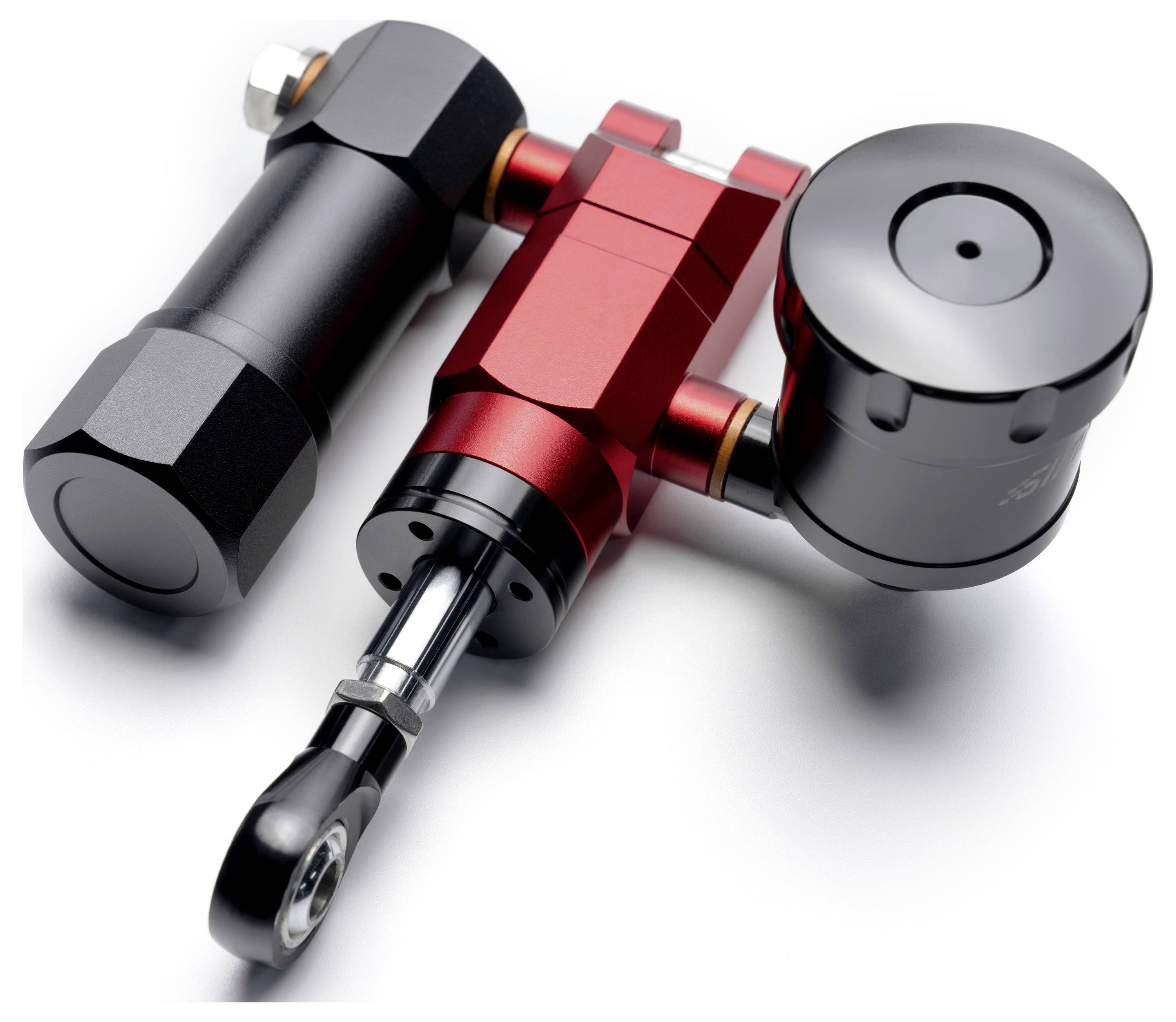 Drei anodisierte Metallbearbeitungswerkzeuge oder Komponenten – schwarz, rot und silber – auf weißem Hintergrund angeordnet, dargestellt in einer detaillierten Produktansicht.