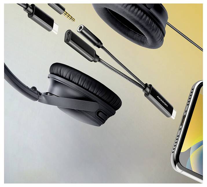 Werbeabbildung von schwarzen Over-Ear-Kopfhörern und Audiokabeln neben einem Smartphone, die kabelgebundene und kabellose Höraccessoires hervorheben.