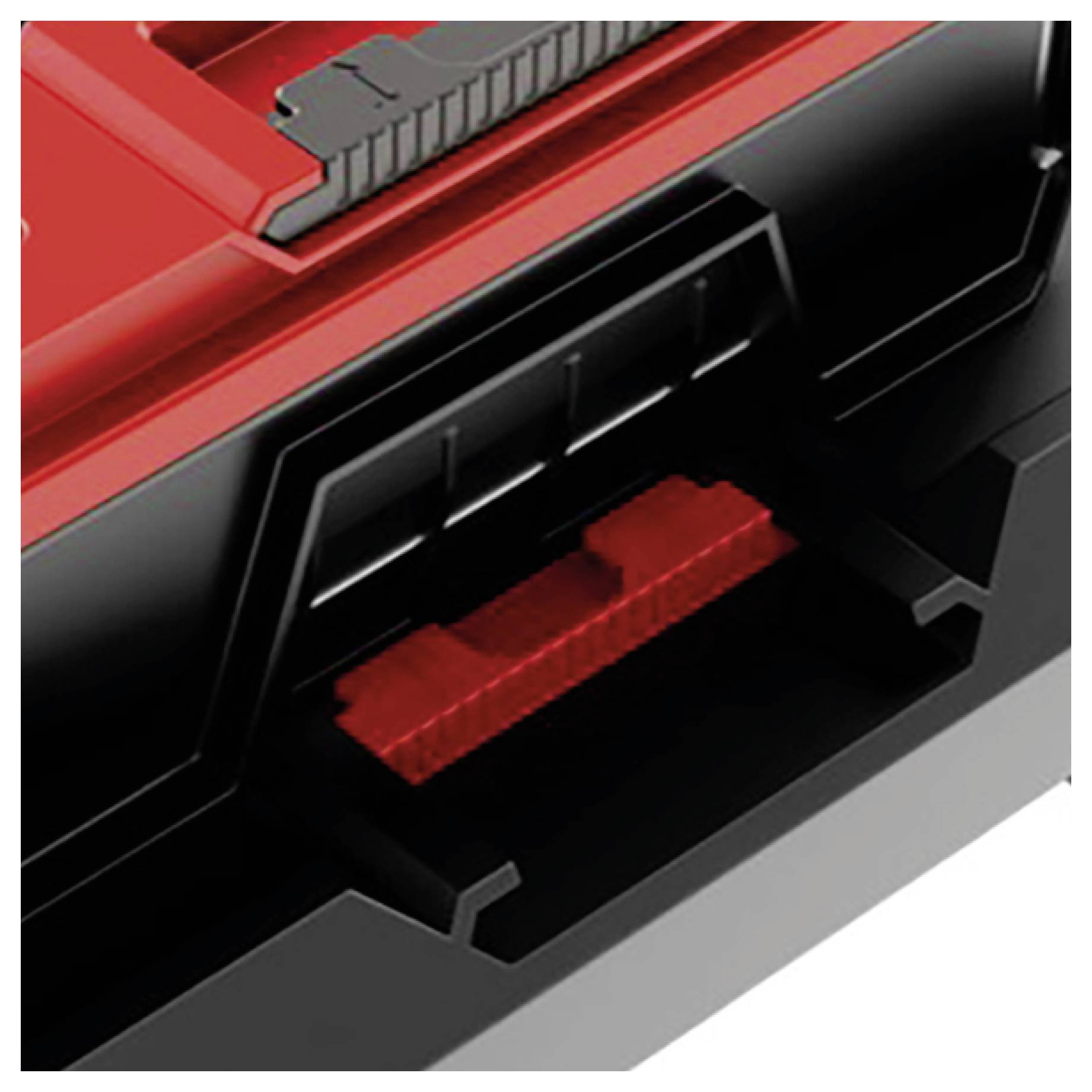 Nahaufnahme eines rot-schwarzen Gerätegehäuses mit einer rechteckigen Öffnung und einer sichtbaren roten internen Komponente oder einem roten Stecker im Inneren.