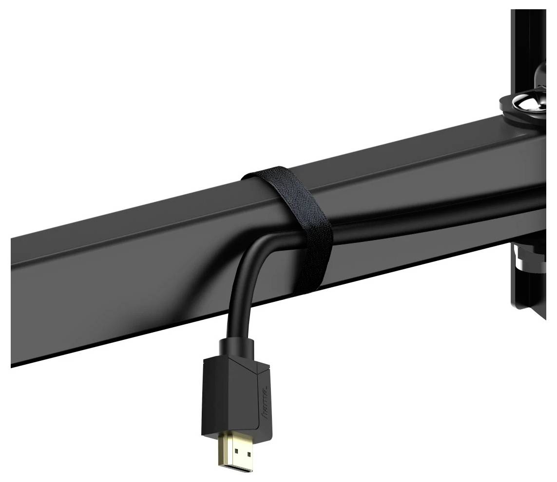 Schwarzes Kabelband, das ein hängendes HDMI-Kabel an einem schwarzen Balken oder Monitorarm auf weißem Hintergrund sichert.