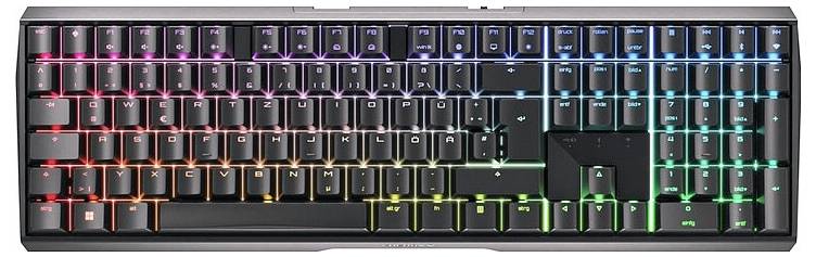 Kompakte mechanische Tastatur mit RGB-Hintergrundbeleuchtung, schwarzen Tasten, Vollformat-Layout und mehrfarbigem Beleuchtungsverlauf von Rot links bis Blaugrün rechts.