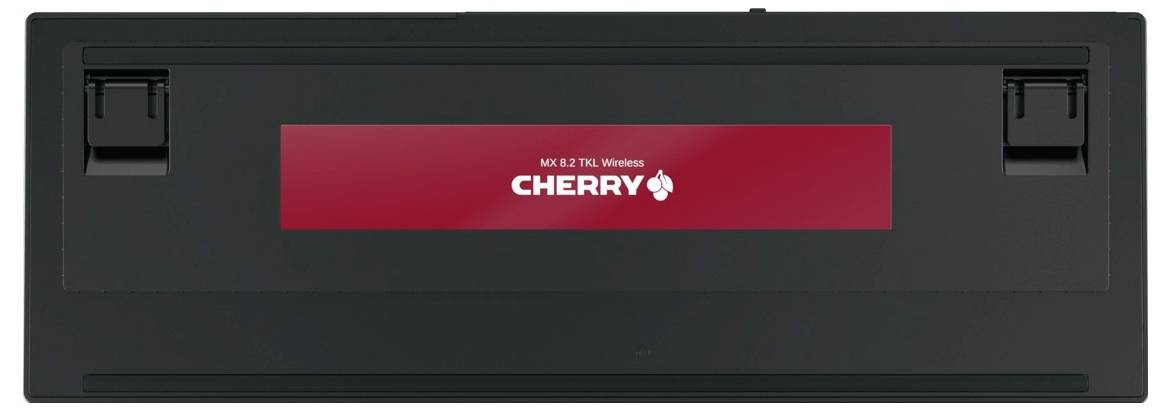 Schwarze kabellose CHERRY-Tastatur, von hinten gezeigt mit rotem CHERRY-Logo-Streifen und integrierten hinteren Füßen/Verschlüssen.