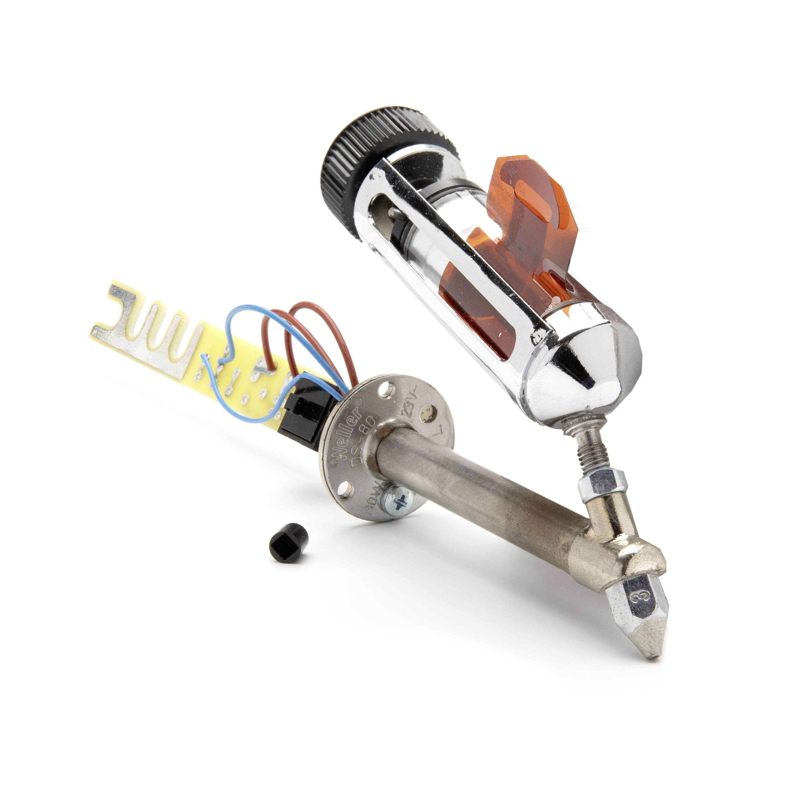 Two small mechanical/electrical components on a white background, including a chrome cylindrical device with wires and a metal shaft assembly.
