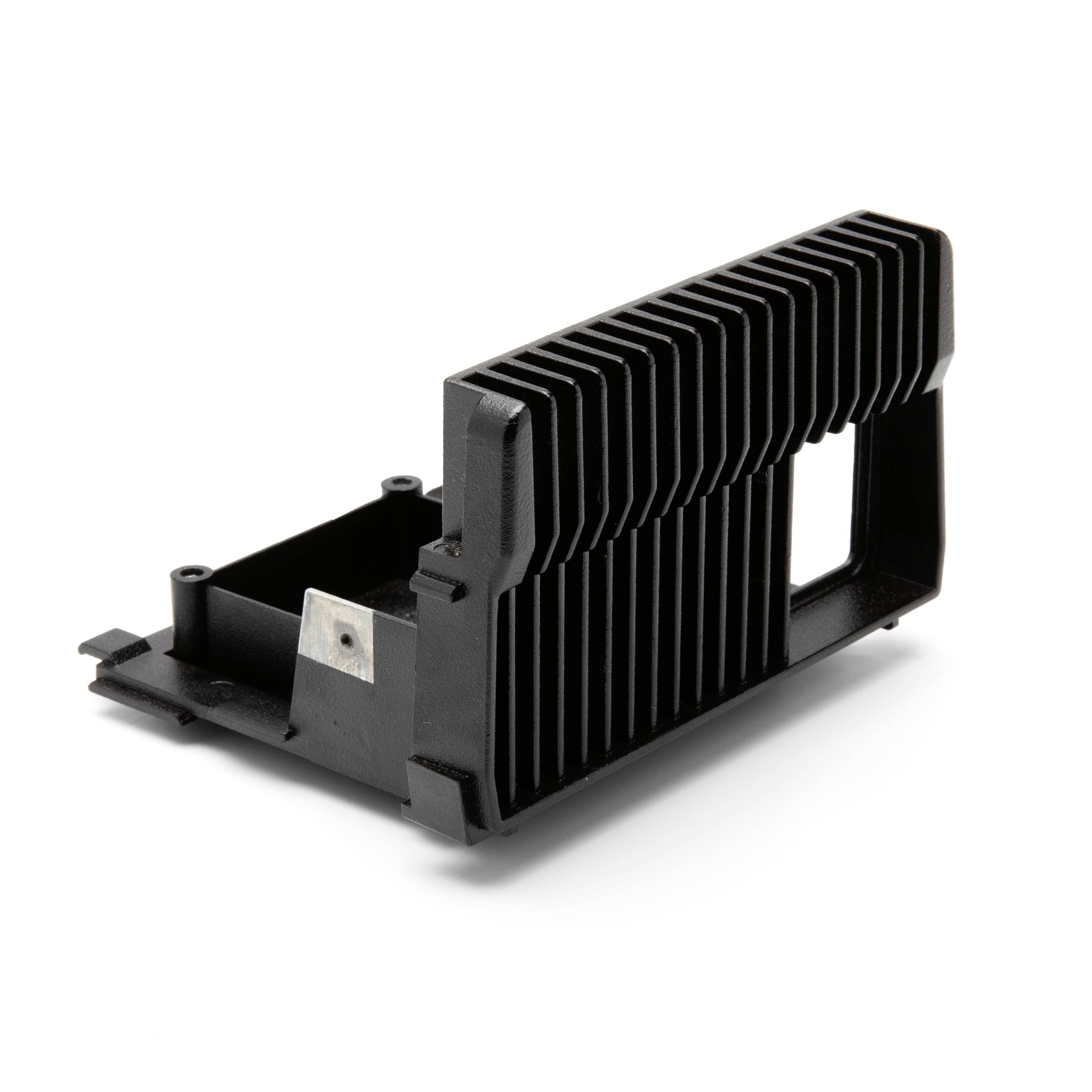 Black finned electronic heat sink or module housing on a white background