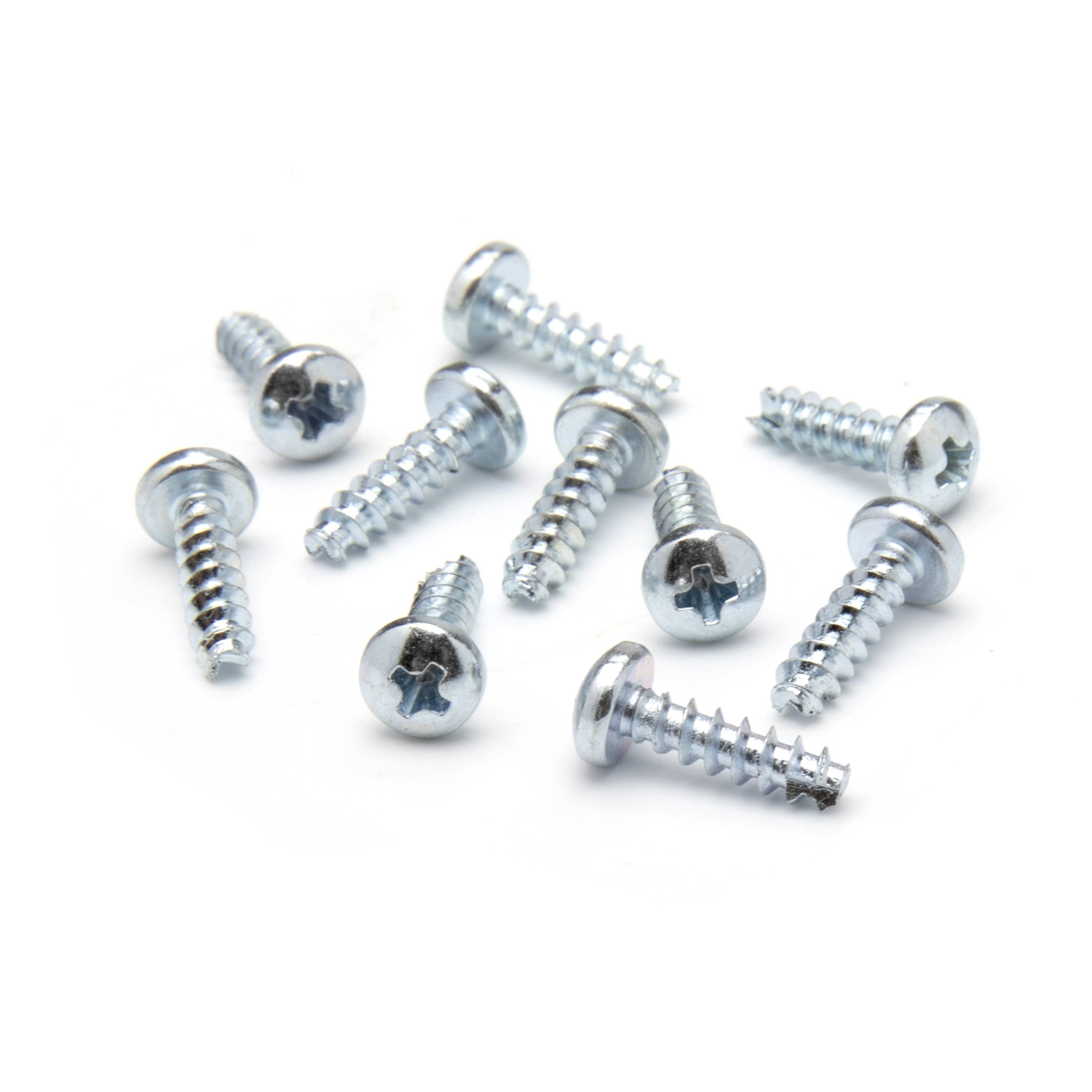 Assorted silver Phillips-head screws scattered on a white background.