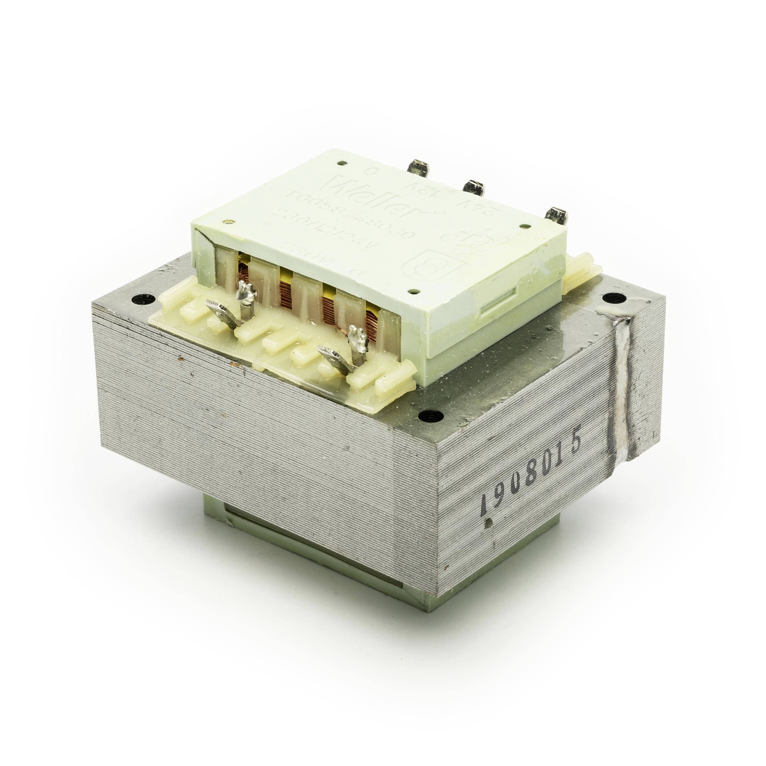 Close-up of a small electrical transformer or relay module with metal core, plastic housing, and visible terminal pins on a white background