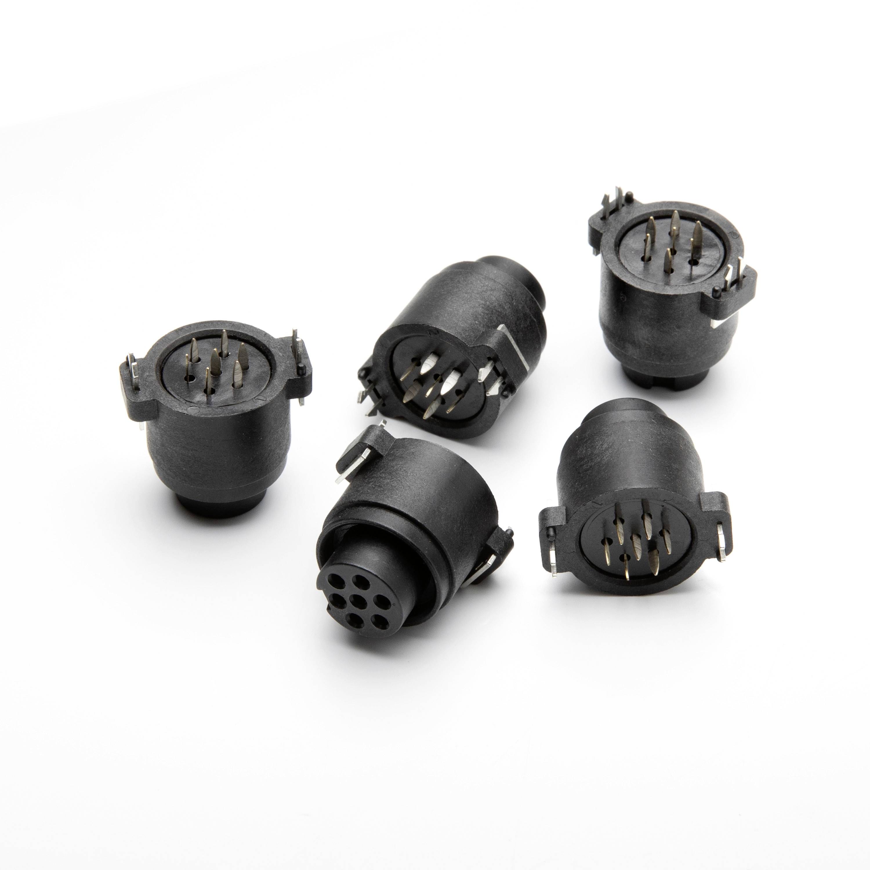 Five black circular electrical connectors with exposed pins arranged on a white background.