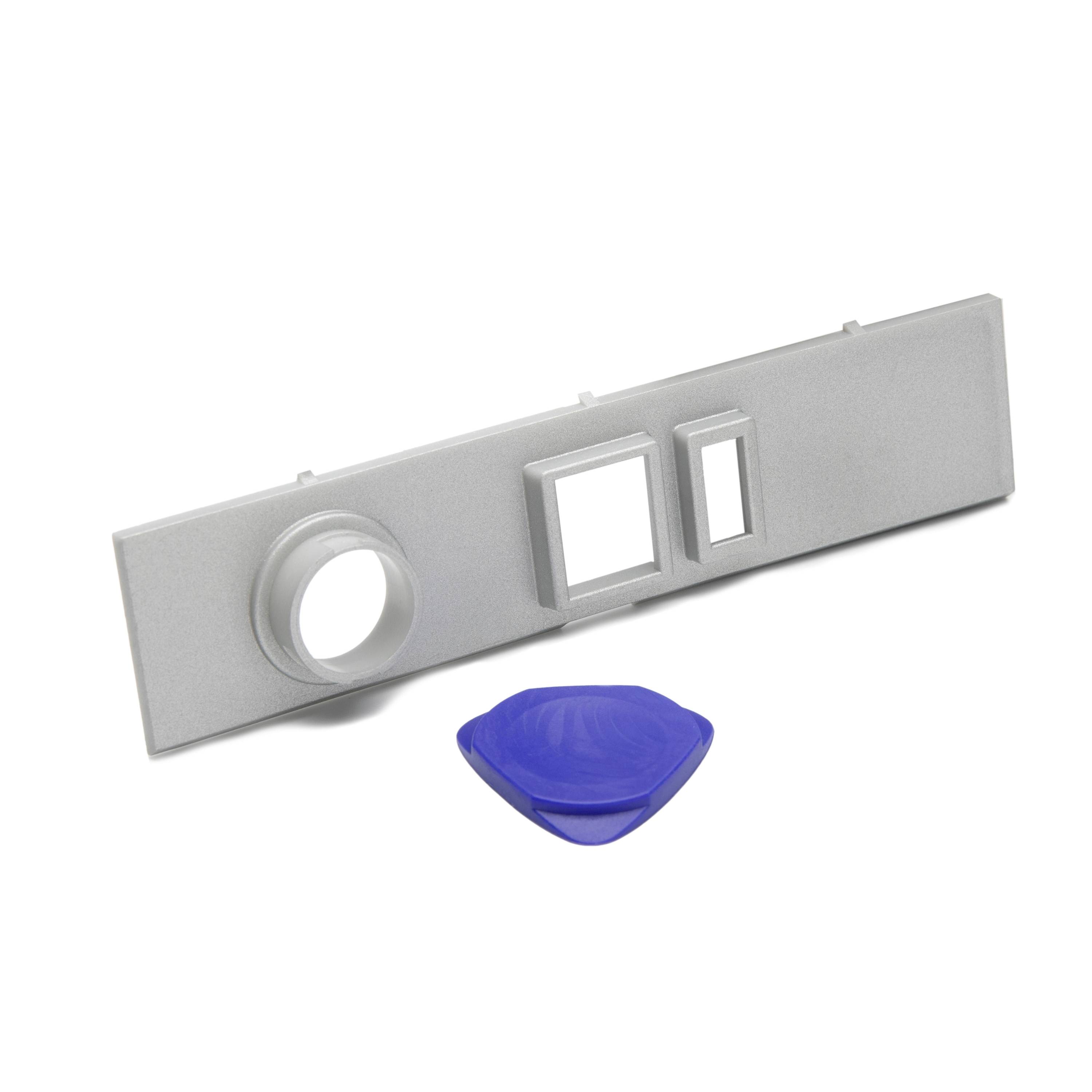 Gray wall plate with one round opening and two rectangular openings, shown with a blue plastic insert below it.