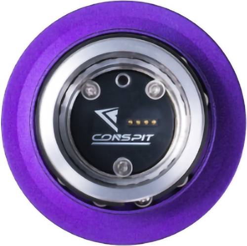 Violettes kreisförmiges CONSPIT-Gerät mit schwarzem Mittelpunkt, Metallring, Schrauben und kleinen LED-Indikatoren.