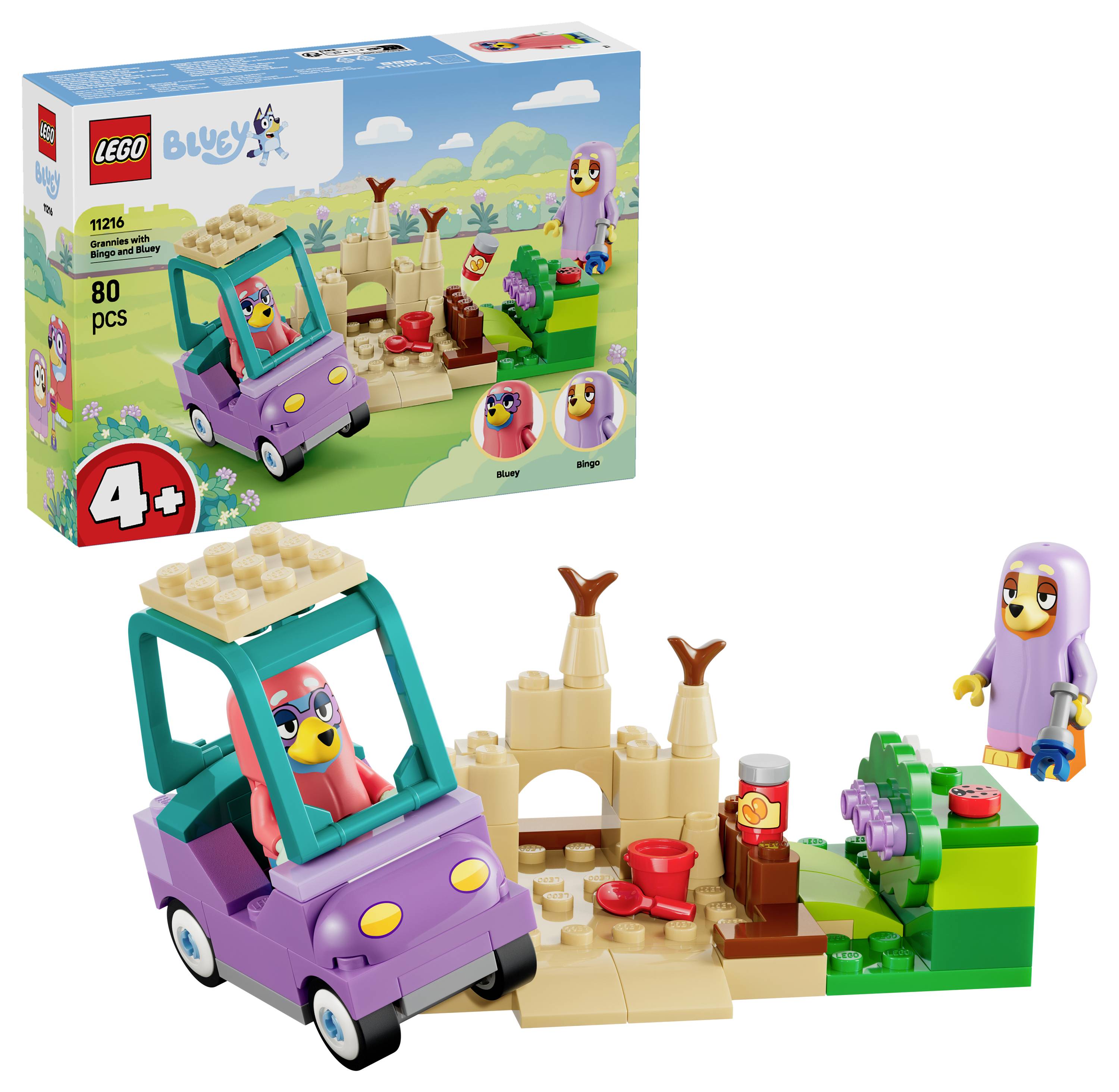 LEGO Duplo 'Peppa Pig' Schachtel und aufgebaute Szene, die zeigt, wie Peppa in einem violetten Auto an einer kleinen Sandburg und einer violetten Vogelfigur vorbeifährt.