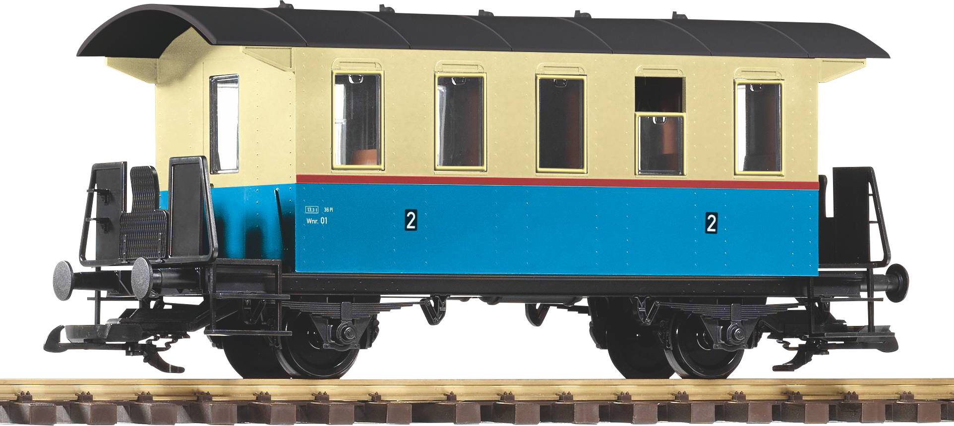 Modell eines Eisenbahnwagens oder Fahrgastkabinenaufbaus mit dunkelblauem Dach und orangefarbener Seitenwand, angezeigt auf einem Ständer vor dunklem Hintergrund.