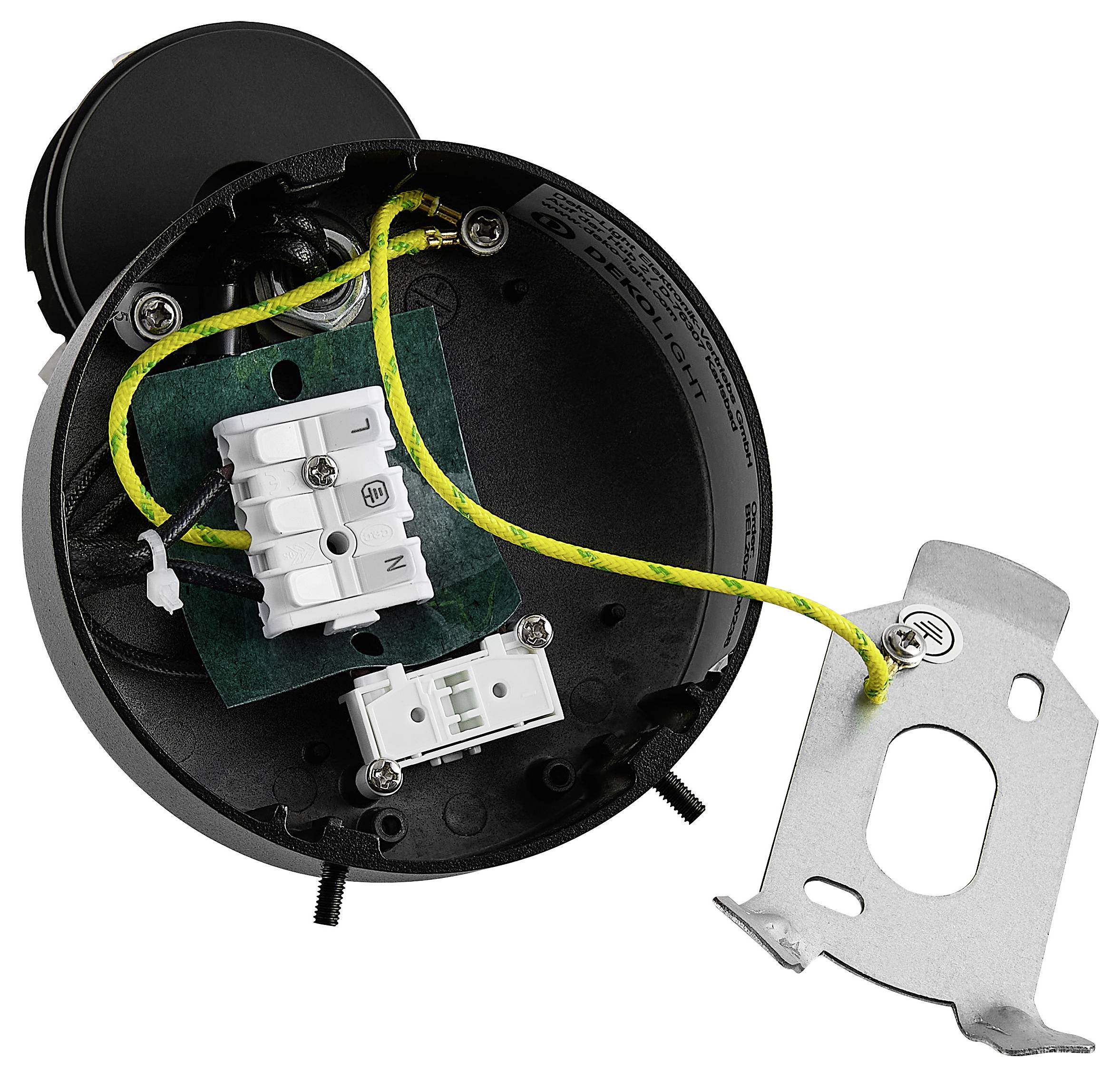 Elektrisches Verbindungskasten-Inneres mit Erdungsleiter, der an einer Metallmontageklammer befestigt ist, und weißen Klemmenblöcken in einem schwarzen runden Gehäuse.