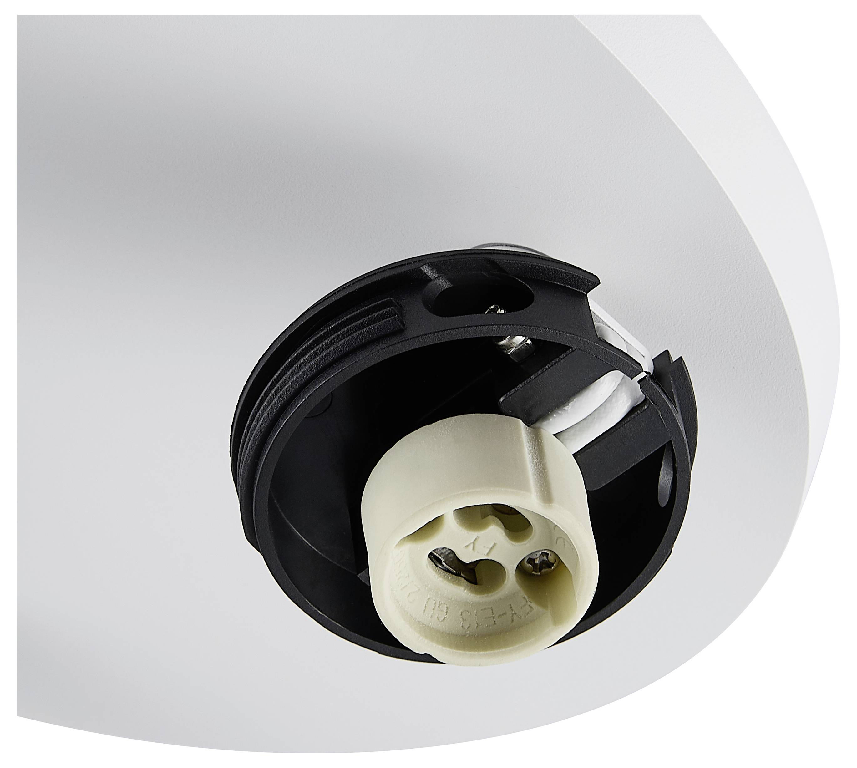 Eine verdrahtete elektrische Komponente mit weißem zylindrischem Gehäuse, freiliegenden Federn und Anschlüssen, verbunden durch gelb-grüne und weiße Kabel mit einem schwarzen Akku oder Steuergerät.