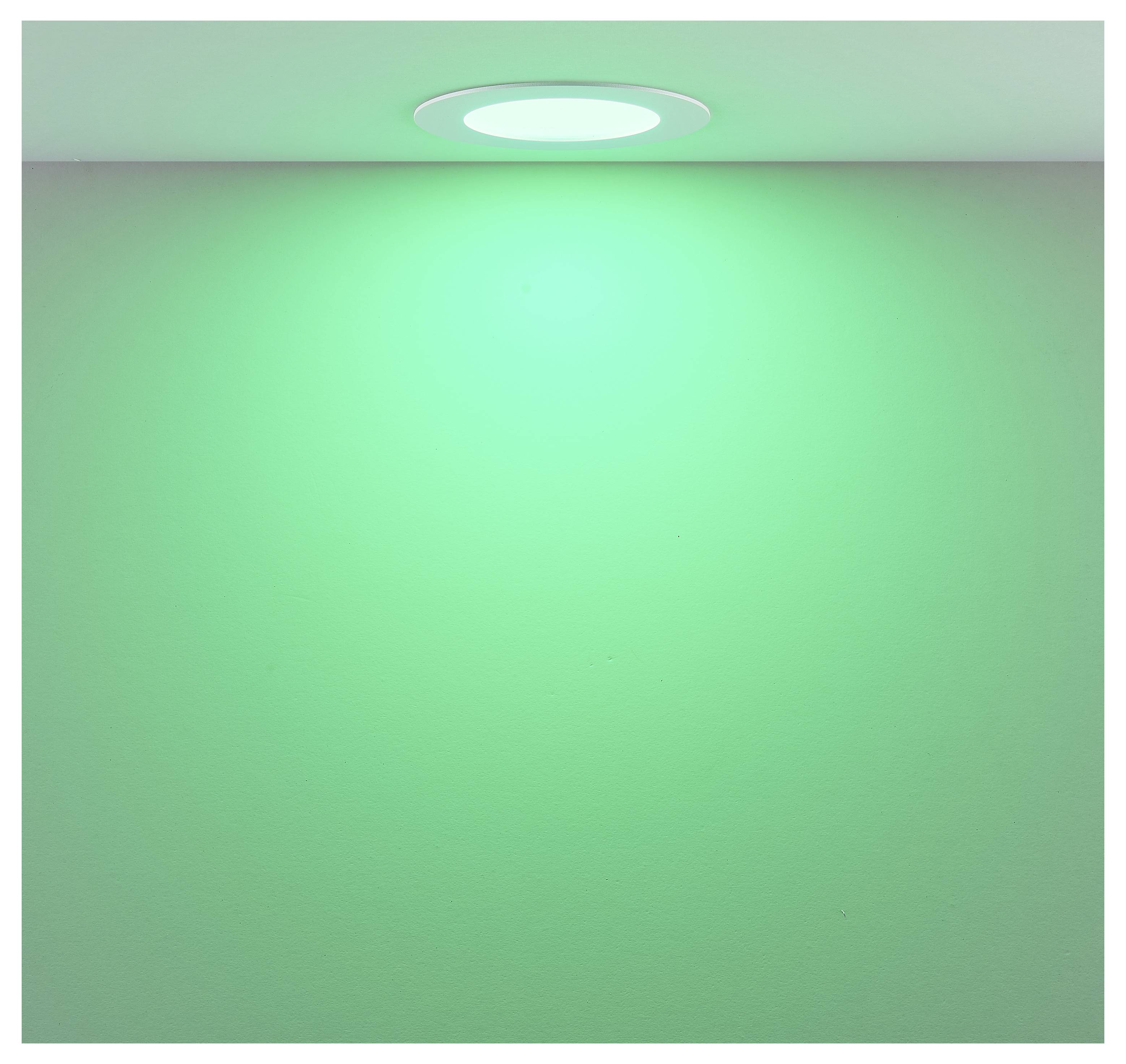 An der Decke montierte kreisförmige Leuchte, die ein weiches grünes Licht auf eine schlichte Wand oder Oberfläche wirft.