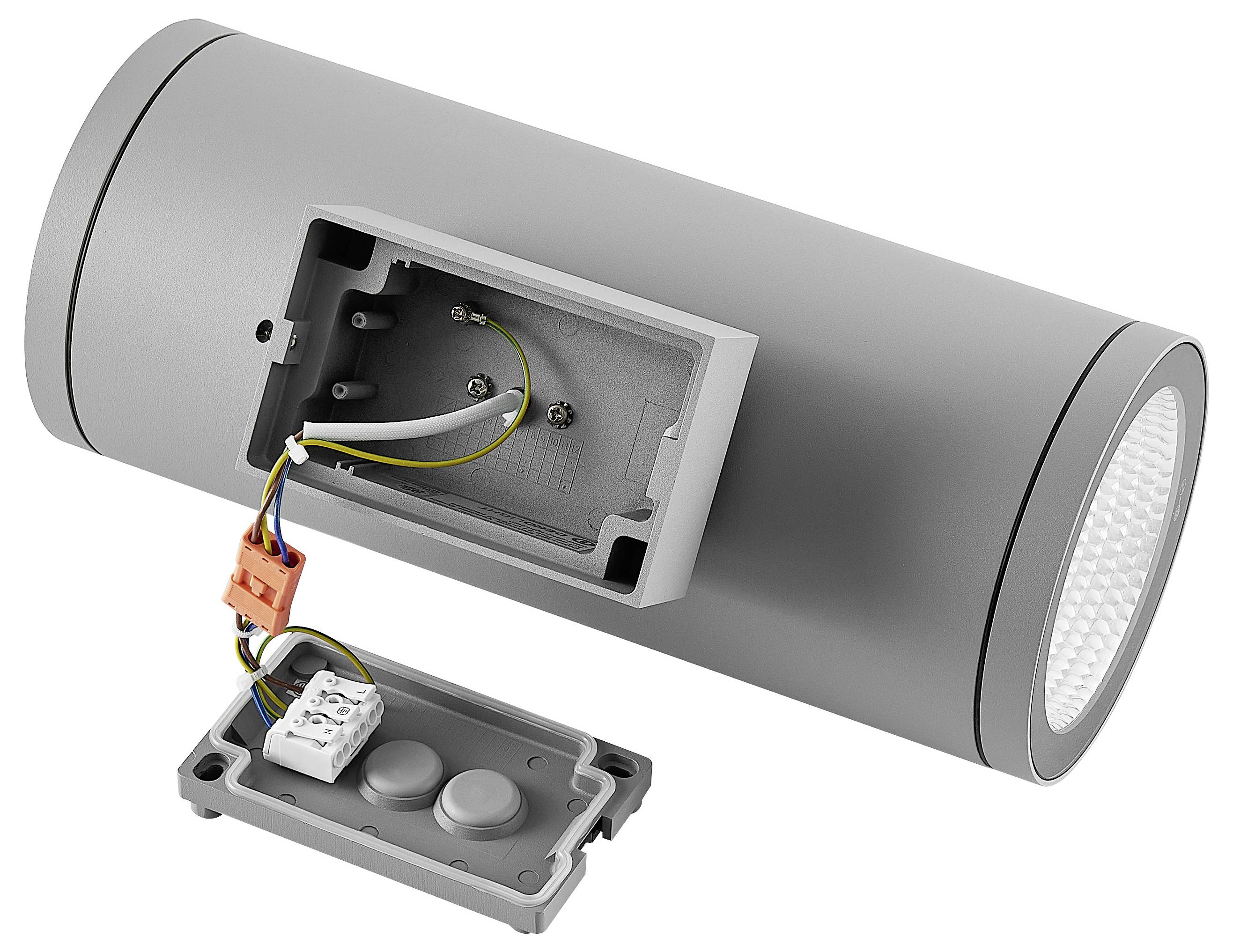 Zylindrische Wandleuchte mit offener Verdrahtungskammer und abgelöstem Deckel, der die elektrischen Verbindungen im Inneren zeigt.