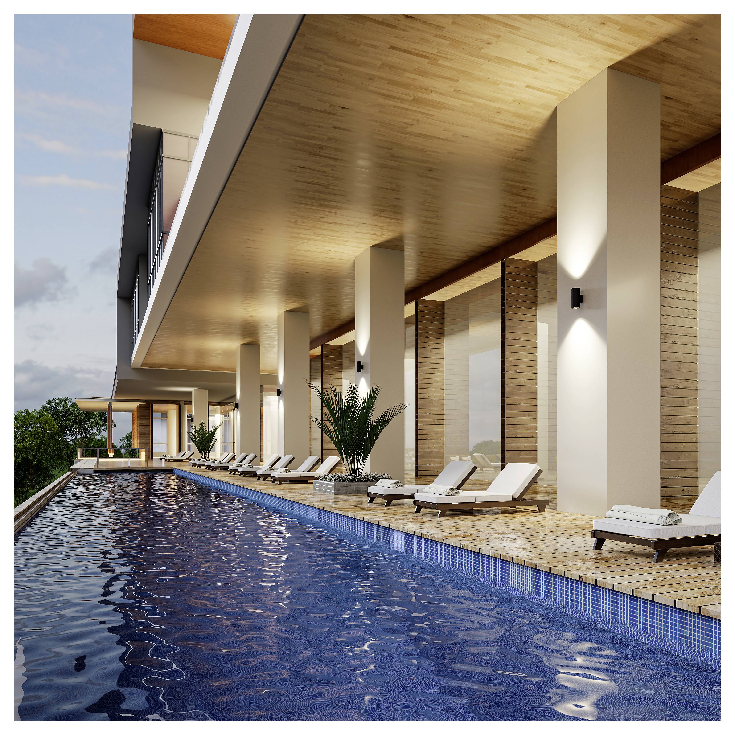 Modernes Hotelpool-Terasse mit langem blauem Infinity-Pool, Liegestühlen und holzvertäfeltem überdachtem Sitzbereich in der Dämmerung.
