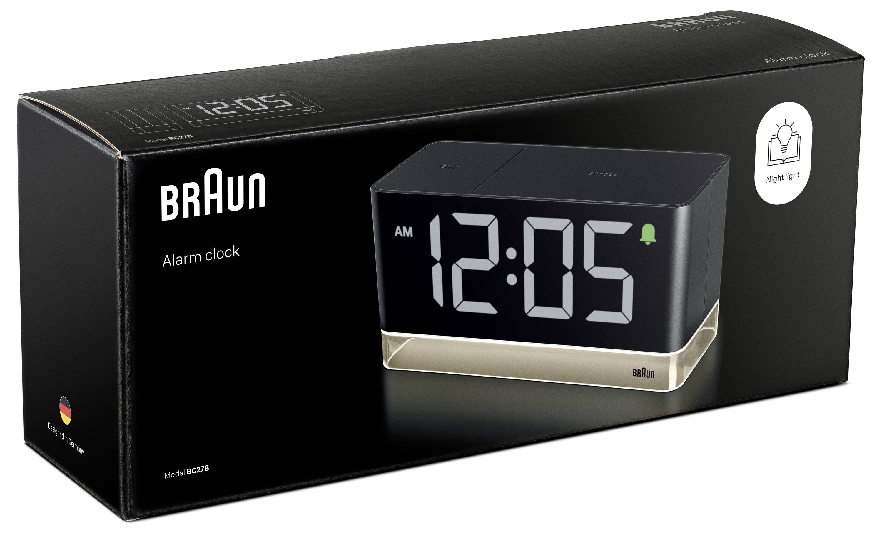Verpackung einer Braun-Wecker mit digitalem Display, das 12:05 anzeigt, und einem Symbol für die Nachtlicht-Funktion.