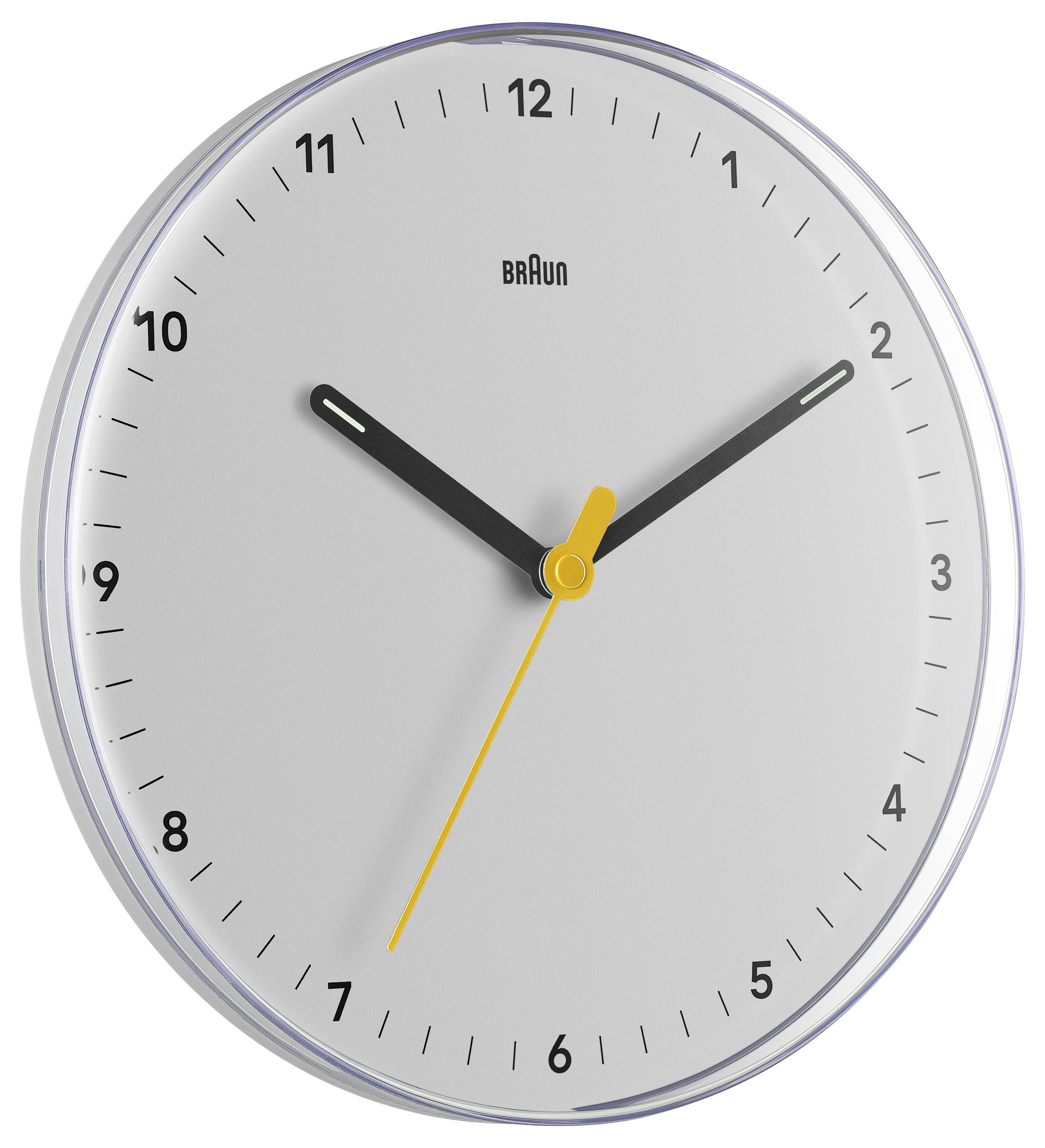 Analoge Braun-Wanduhr zeigt etwa 10:10, mit dünnem gelbem Sekundenzeiger und weißem Zifferblatt mit schwarzen Ziffern.