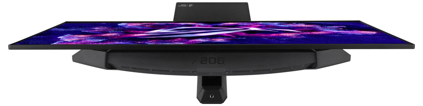Ultrabreites gekrümmtes Gaming-Monitor auf einem Ständer, das ein farbenfrohe abstrakte Anzeige und ein zentrales Unter-Bildschirm-Webcam- oder Sensormodul zeigt.