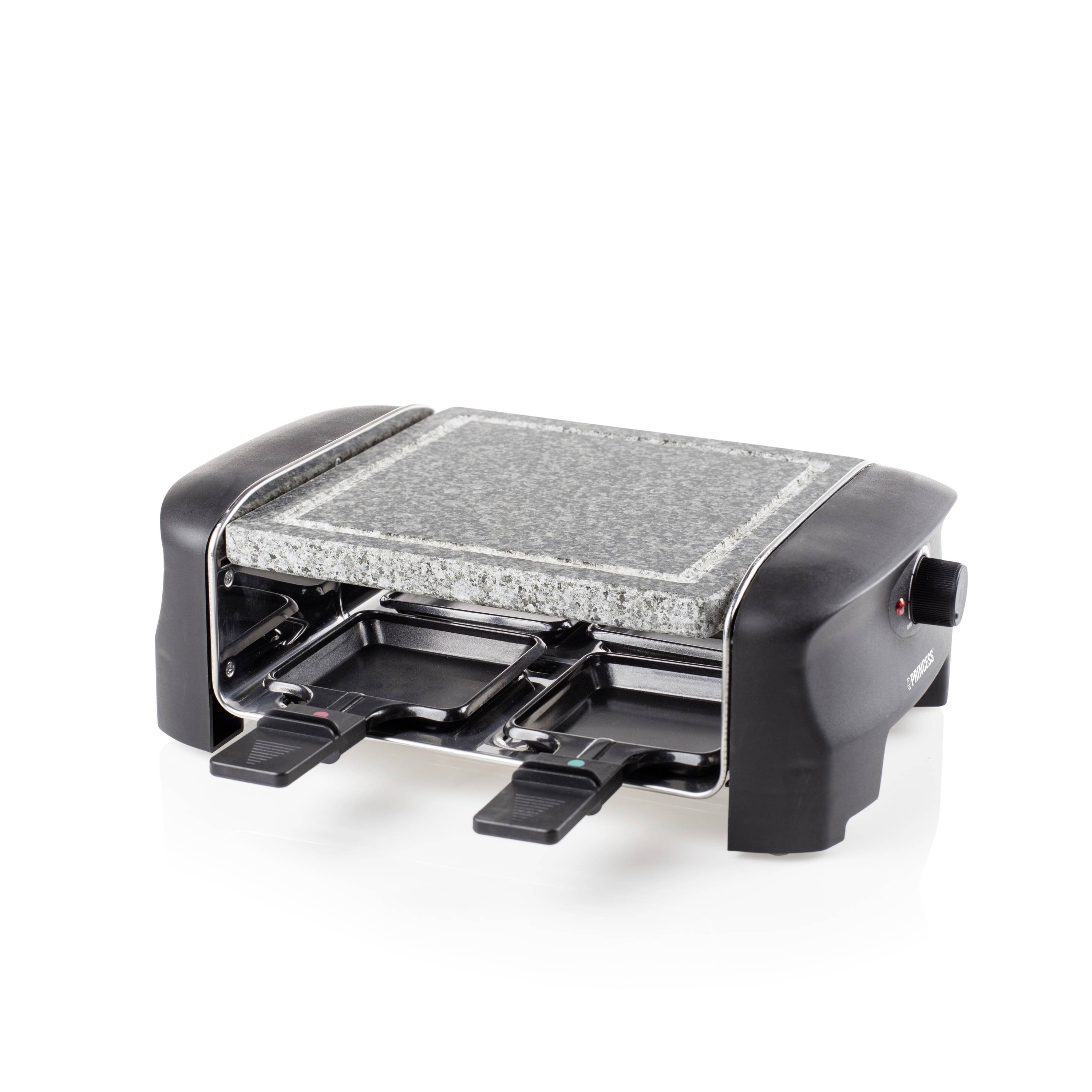 Raclette de table électrique avec une surface en pierre chaude et deux plateaux de cuisson amovibles sur un fond blanc.