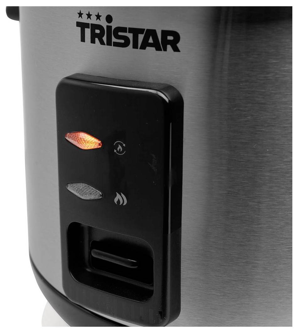 Nahaufnahme eines Tristar-Bedienfeldes aus Edelstahl mit zwei Kontrollleuchten, Flammensymbolen und einem unteren Schalter oder Drehregler.