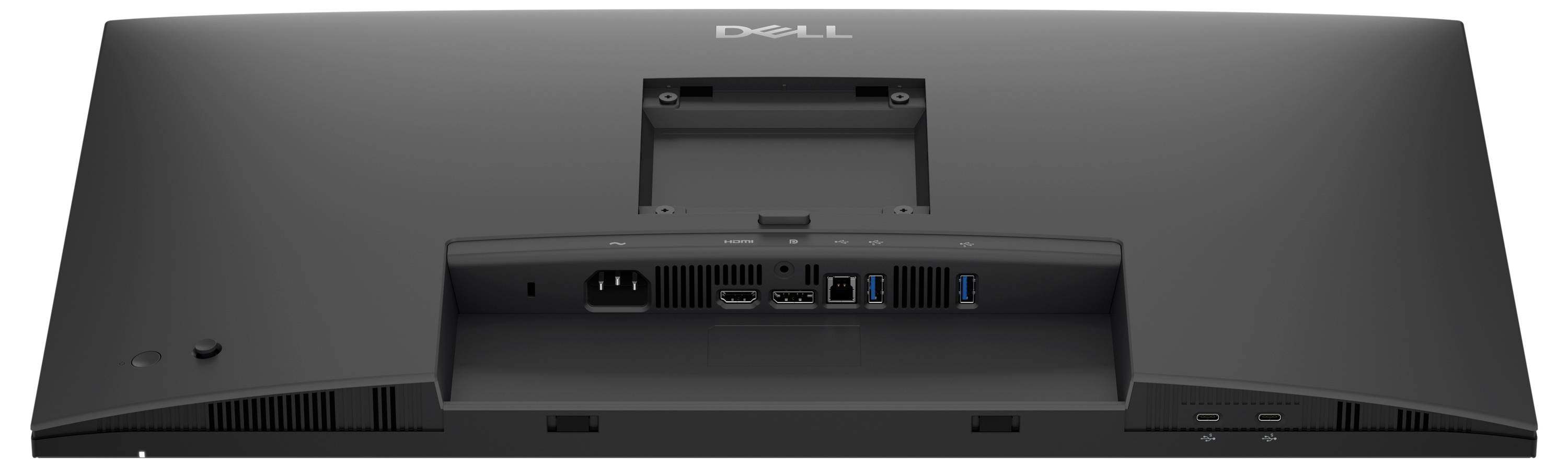 Zugeklappter Laptop auf einem Holzschreibtisch mit einem grünen USB-Stick daneben.