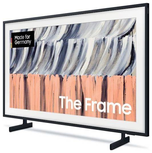 Ein Samsung-ähnlicher Flachbild-Fernseher mit schwarzem Rahmen und Standfuß zeigt abstrakte Kunst und den Text „The Frame