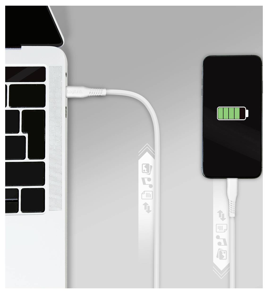 Laptop charging a smartphone via USB cable; phone screen shows a green battery icon indicating charging.