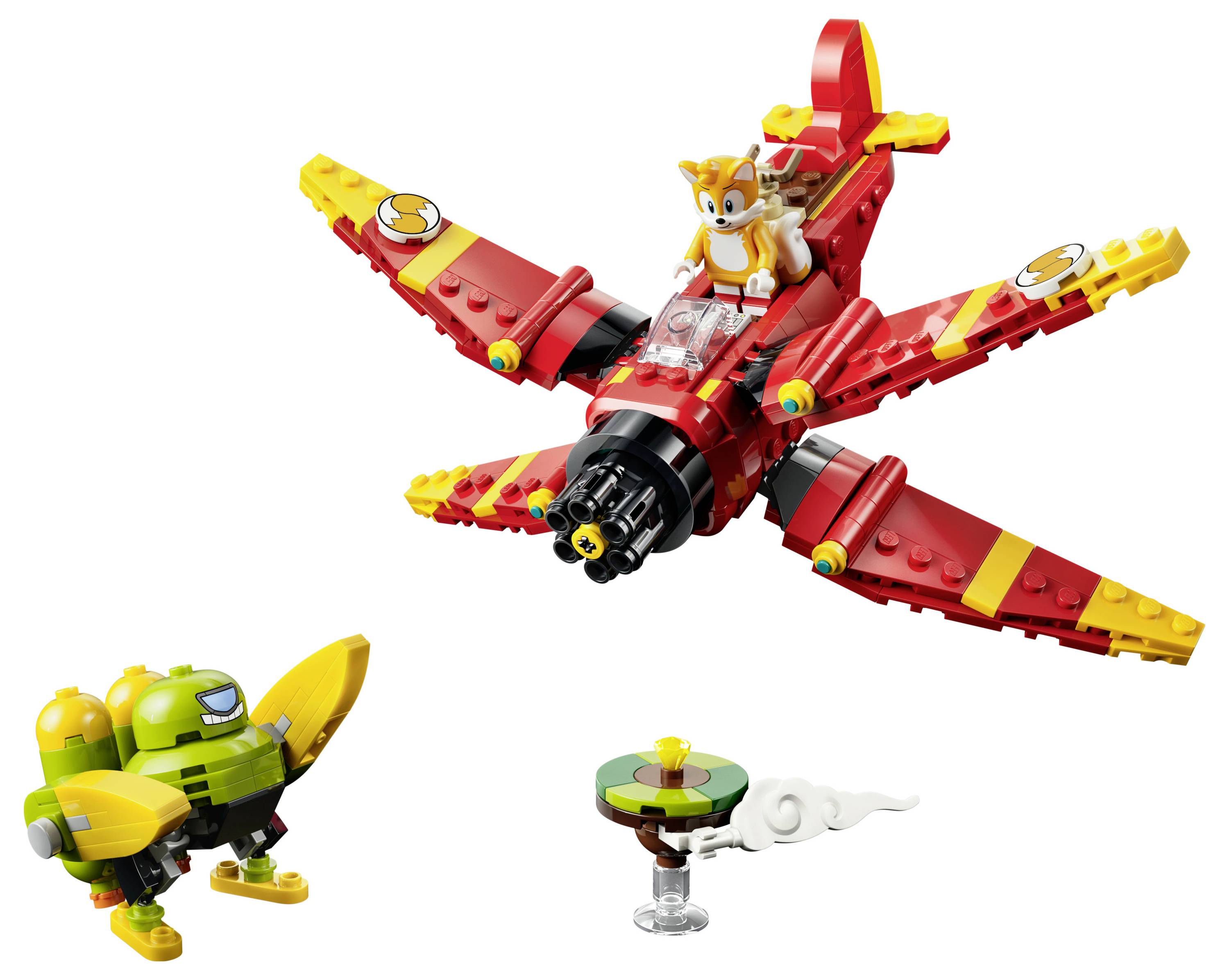 LEGO-ähnliches rotes Flugzeug mit Tails-Figur, das über einer grünen Roboterfigur fliegt, und eine kleine sich drehende Plattform mit Wolkeneffekt.
