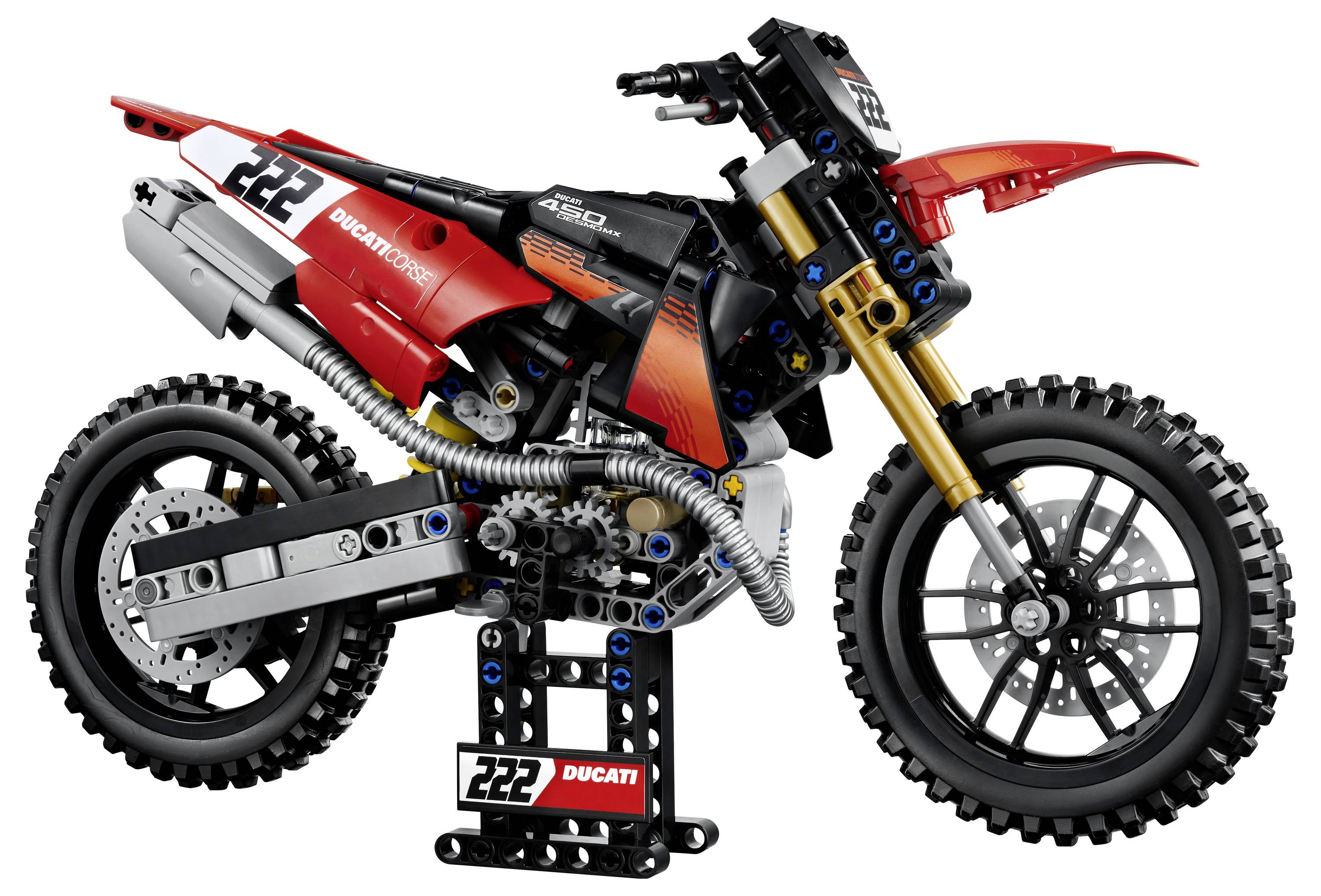 LEGO-ähnliches Ducati-Gelände-Motorrad-Modell in Rot, Schwarz und Orange, dargestellt in Seitenansicht auf einem Ständer mit der Nummer 222.