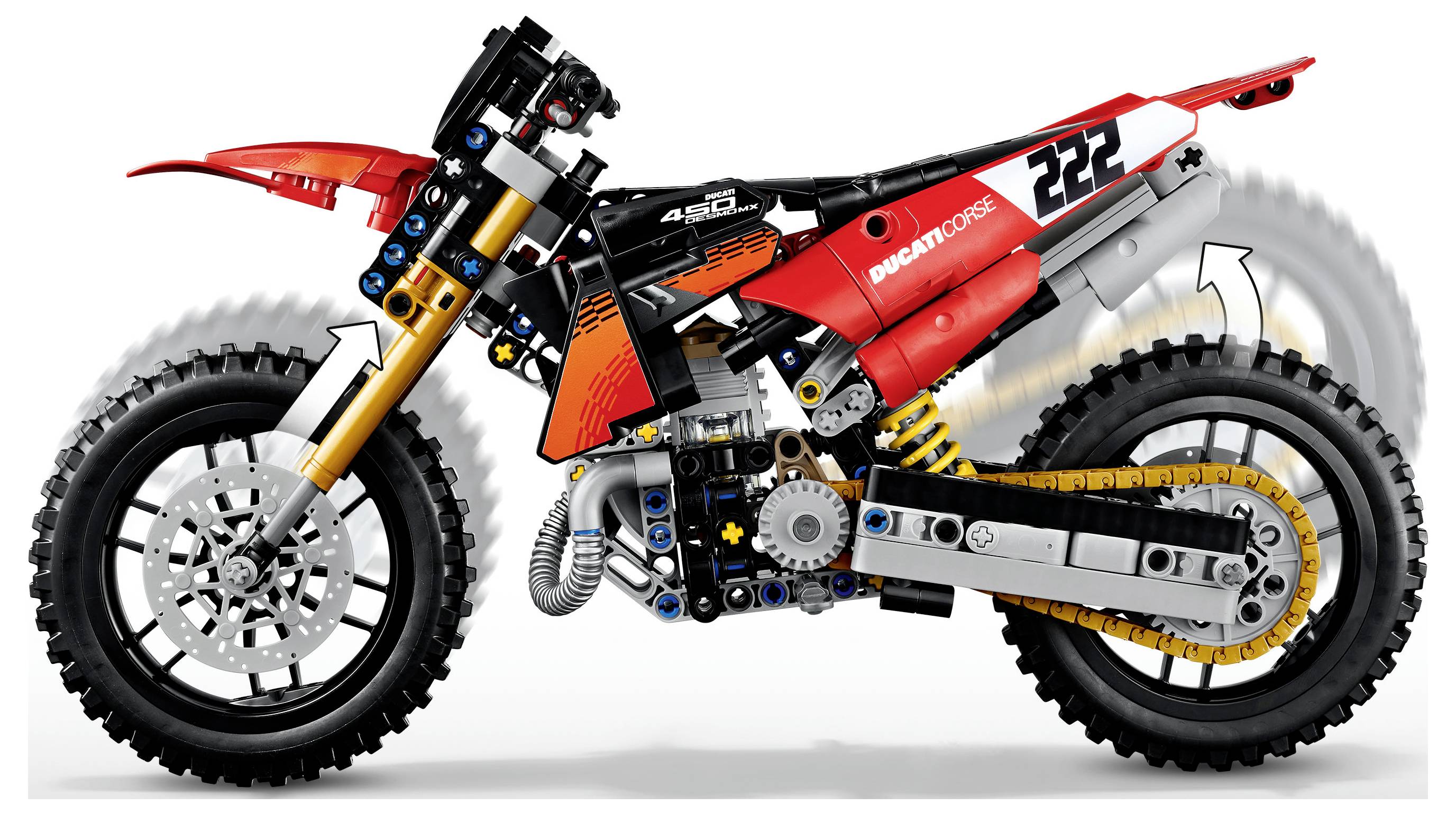 Rot-schwarzes Offroad-Motorrad in Seitenansicht, ein Ducati-ähnliches Dirt Bike mit der Nummer 22 und sichtbarem Motor, Federung und Stollen-Reifen.