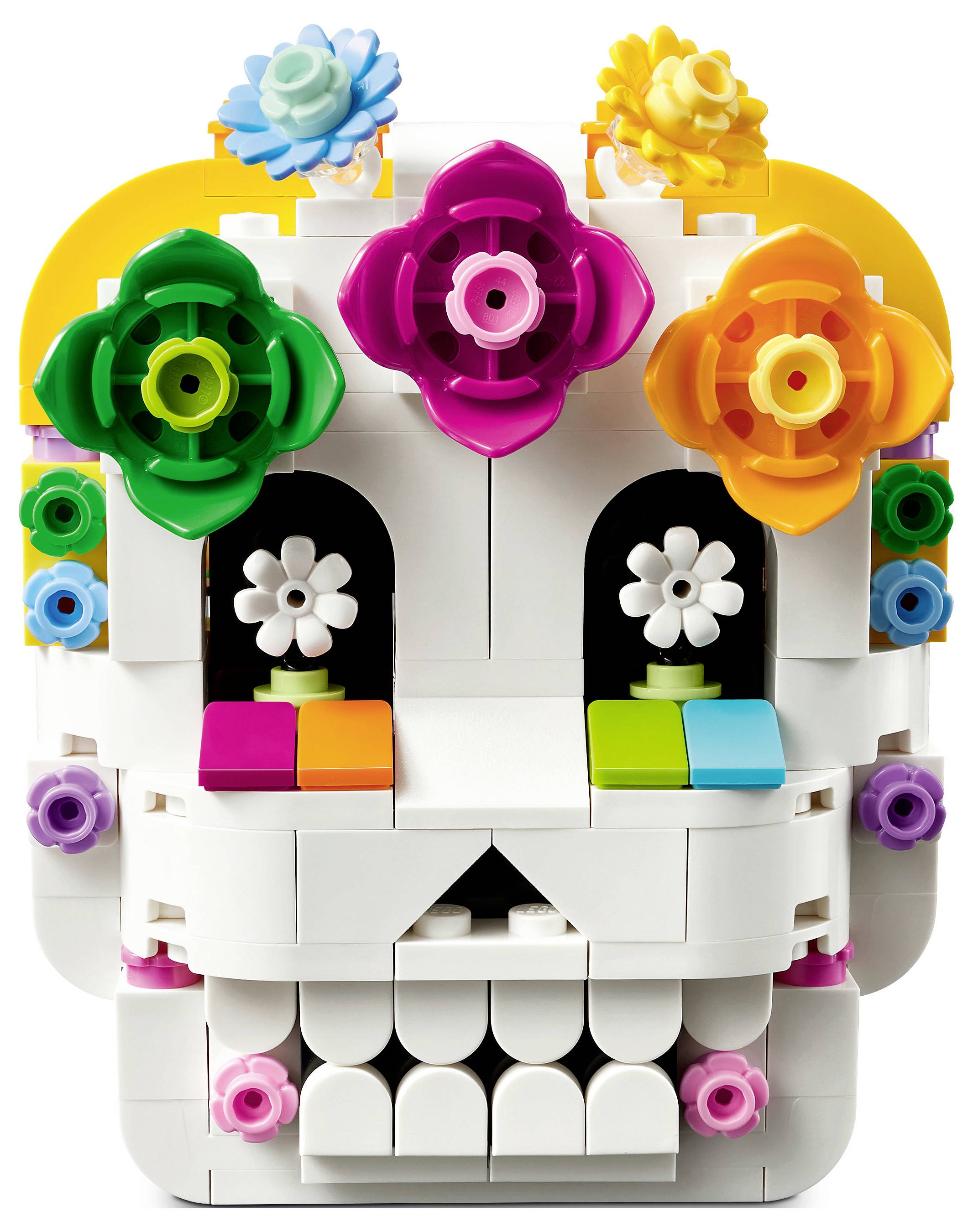 Bunter Spielzeugschädel aus Bausteinen mit blumenförmigen Verzierungen oben und um die Augen und Wangen herum.