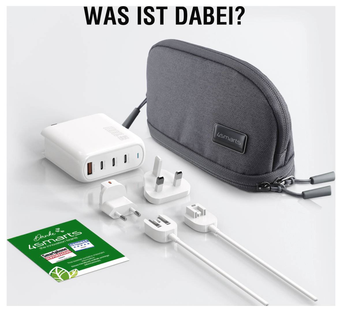 Produktkit-Bild zeigt eine graue 4smarts-Tasche, ein weißes Multi-Port-USB-Ladegerät, mehrere internationale Steckdosenadapter, zwei Ladekabel und eine grüne Bedienungsanleitung unter dem Text 