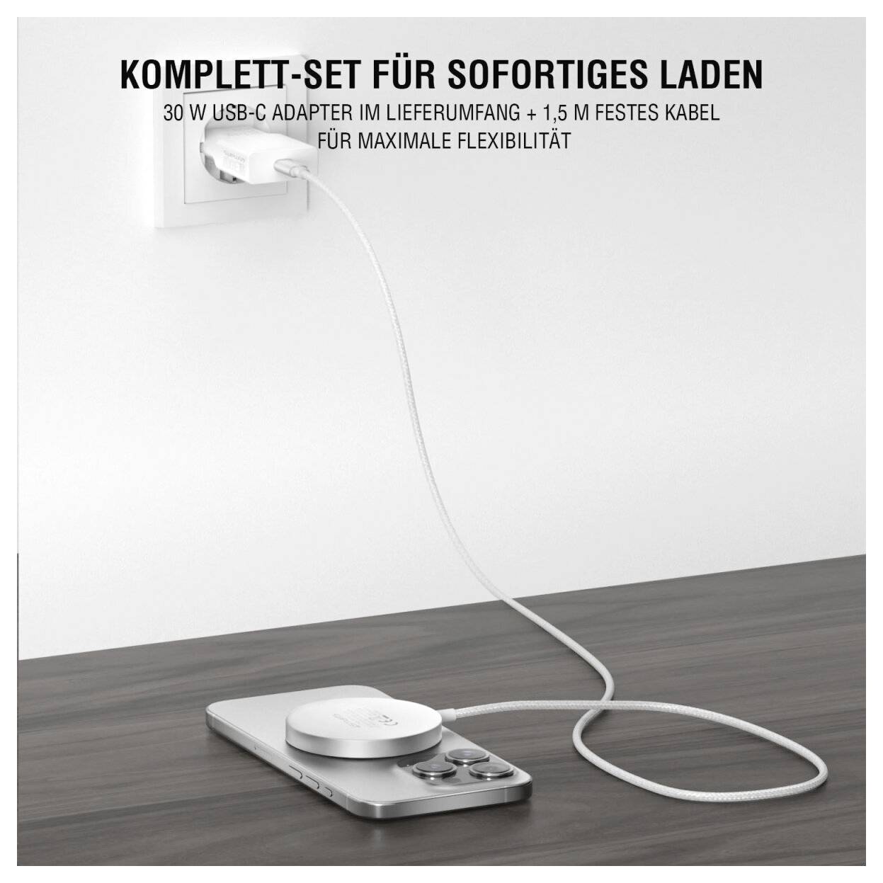 USB-C Wandladegerät mit festem Kabel lädt ein Smartphone auf einem Schreibtisch; Text besagt „Komplett-Set für sofortiges Laden