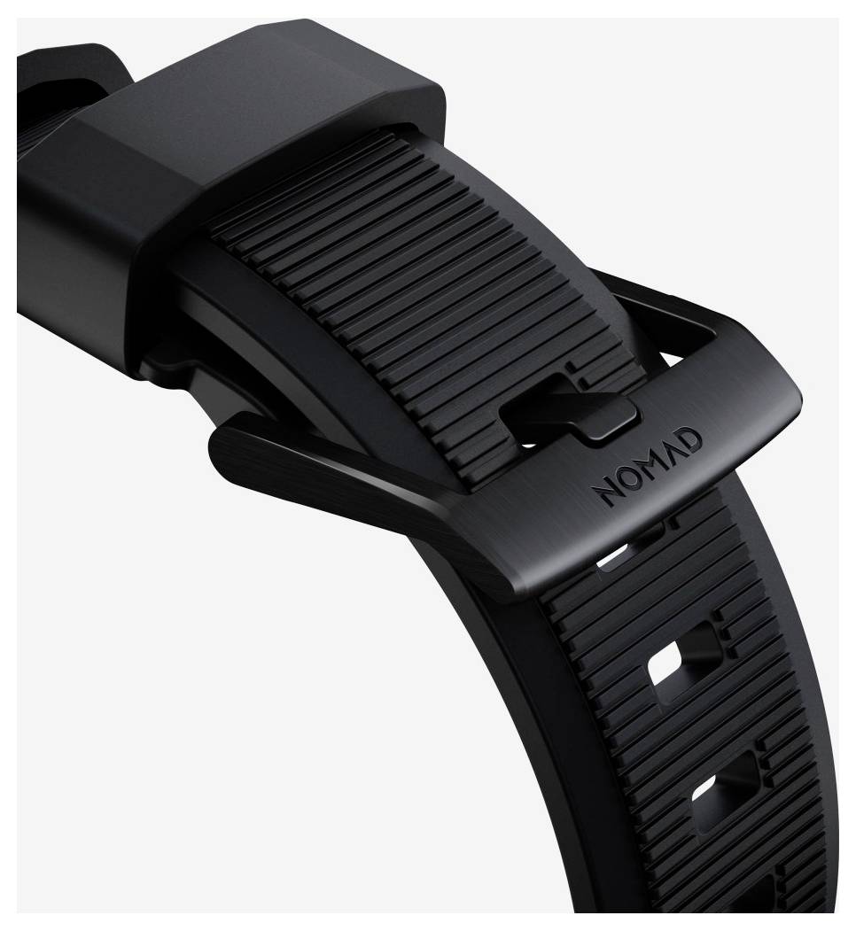 Nahaufnahme einer schwarzen Nomad-Uhrenarmband-Schließe und eines strukturierten Armbands auf weißem Hintergrund.