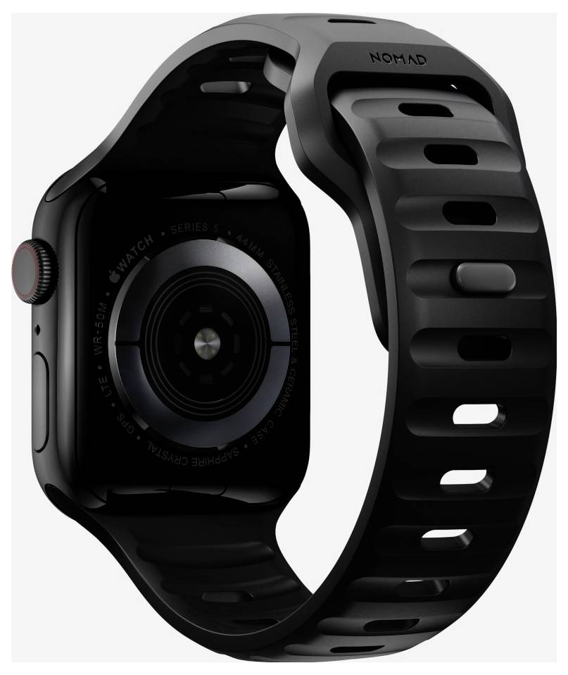 Schwarze Apple Watch mit schwarzem NOMAD-Sportband, in Nahaufnahme auf hellem Hintergrund gezeigt.