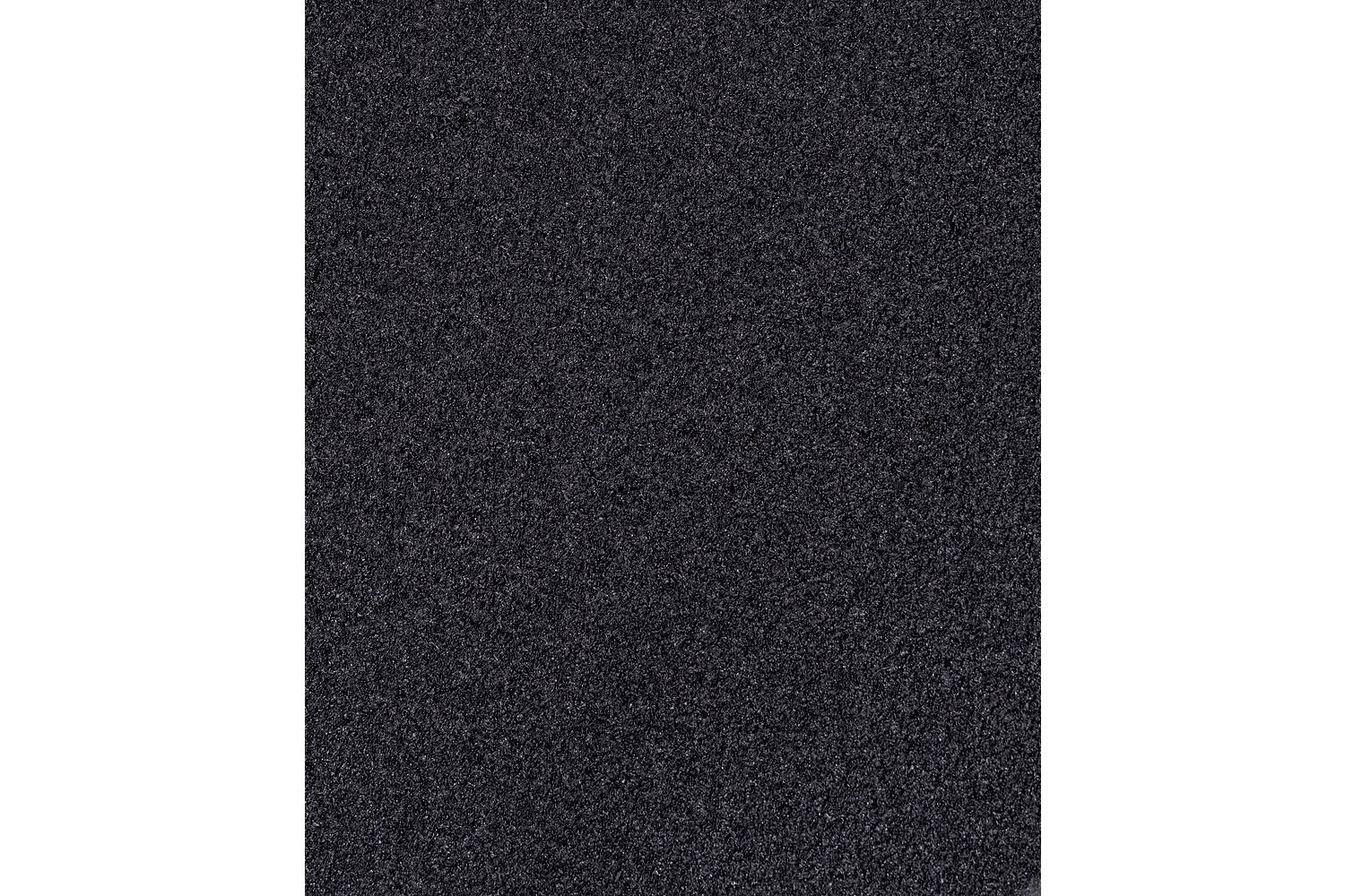 Dark textured surface with a subtle speckled pattern, filling most of the image.