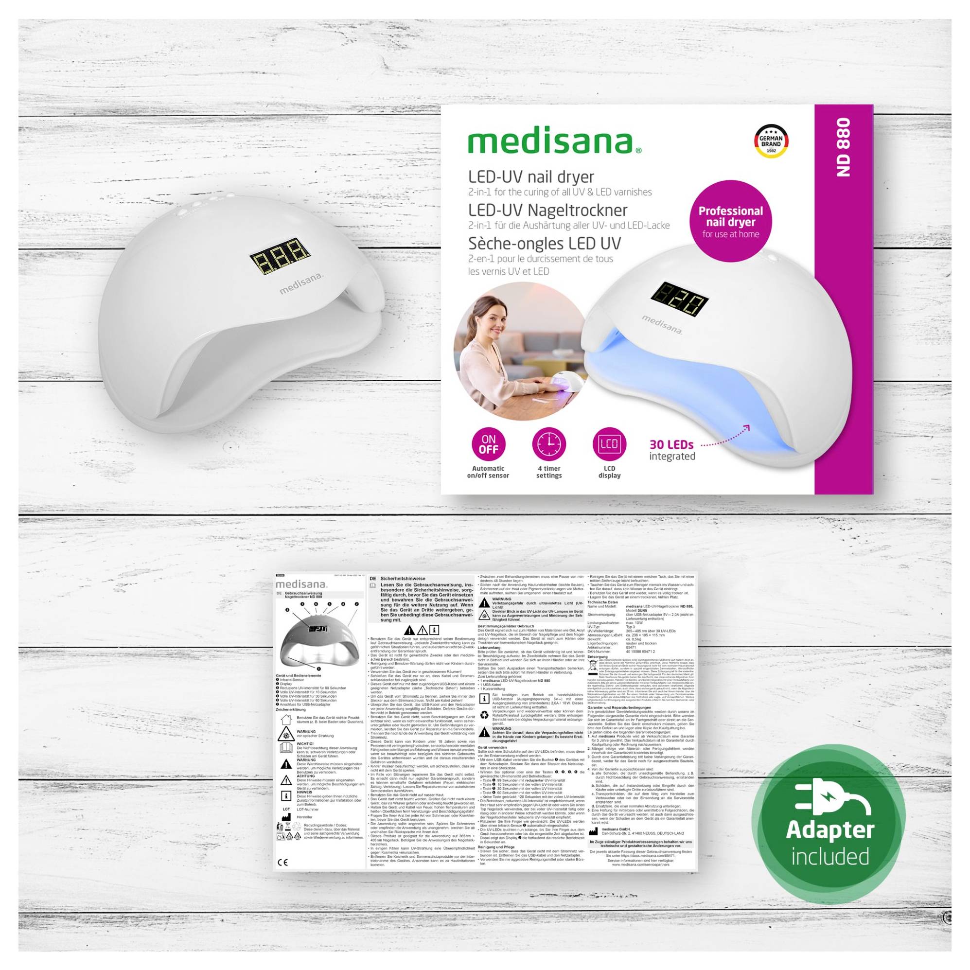 Medisana LED-UV Nageltrockner mit Produktverpackung, Bedienungsanleitung und grünem „Adapter enthalten