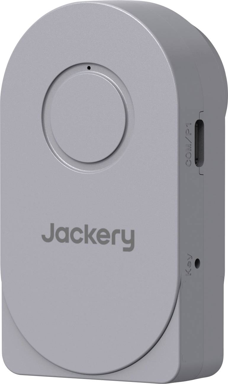 Tragbares Ladegerät von Jackery in Grau mit rundem Knopf und Seitenport, dargestellt in einer produktstilisierten Nahaufnahme.